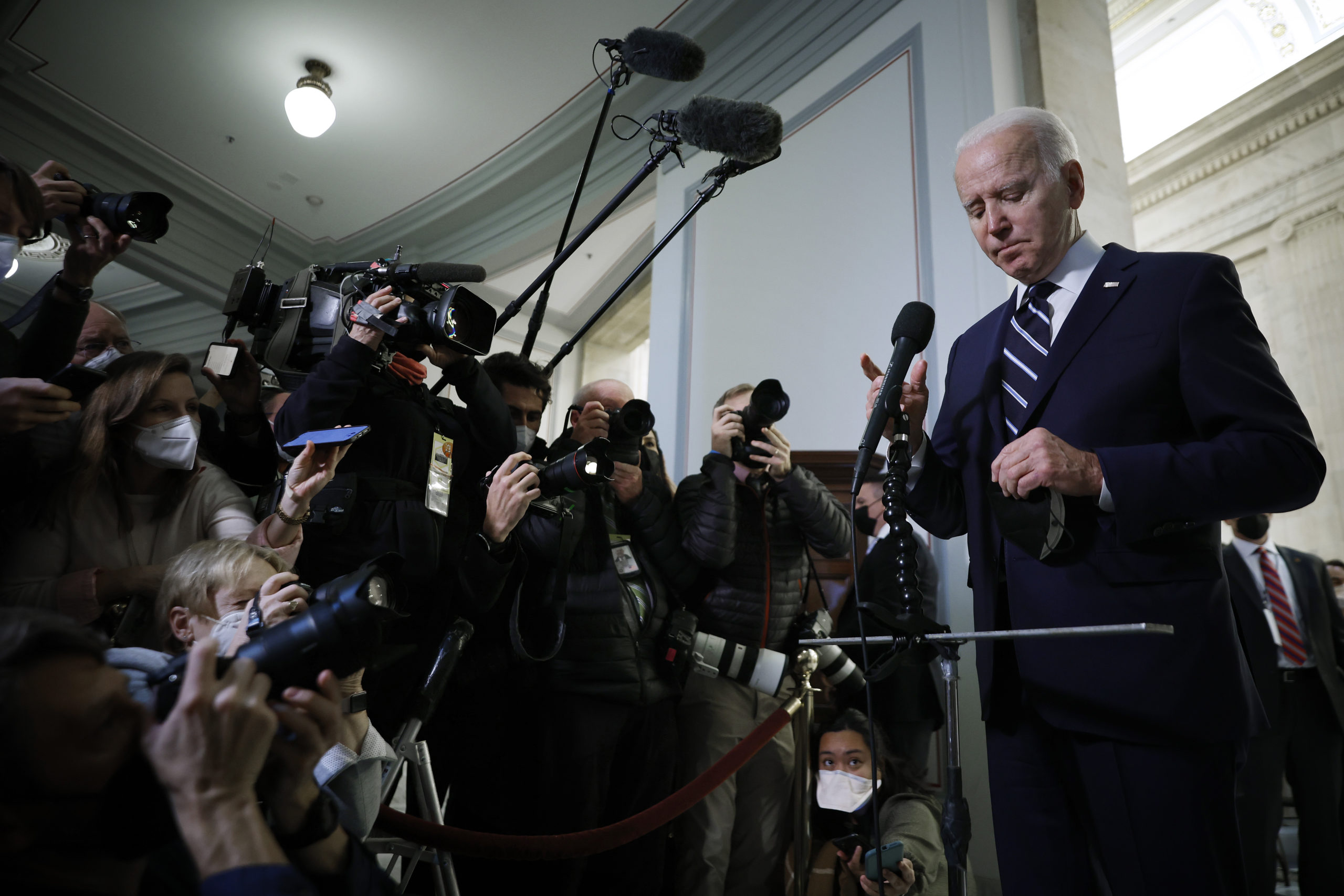 U.S. President Joe Biden talks to reporters after meeting with Senate Democrats in the Russell Senate Office Building on Capitol Hill on January 13, 2022 in Washington, DC. Biden has called on his fellow Democrats to go around Republican opposition, do away with the 60-vote threshold for advancing legislation in the Senate and pass the John Lewis Voting Rights Advancement Act and the Freedom To Vote Act. The strategy is in doubt because Sen. Joe Manchin (D-WV) and Sen. Kyrsten Sinema (D-AZ) oppose doing away with the filibuster. (Photo by Chip Somodevilla/Getty Images)
