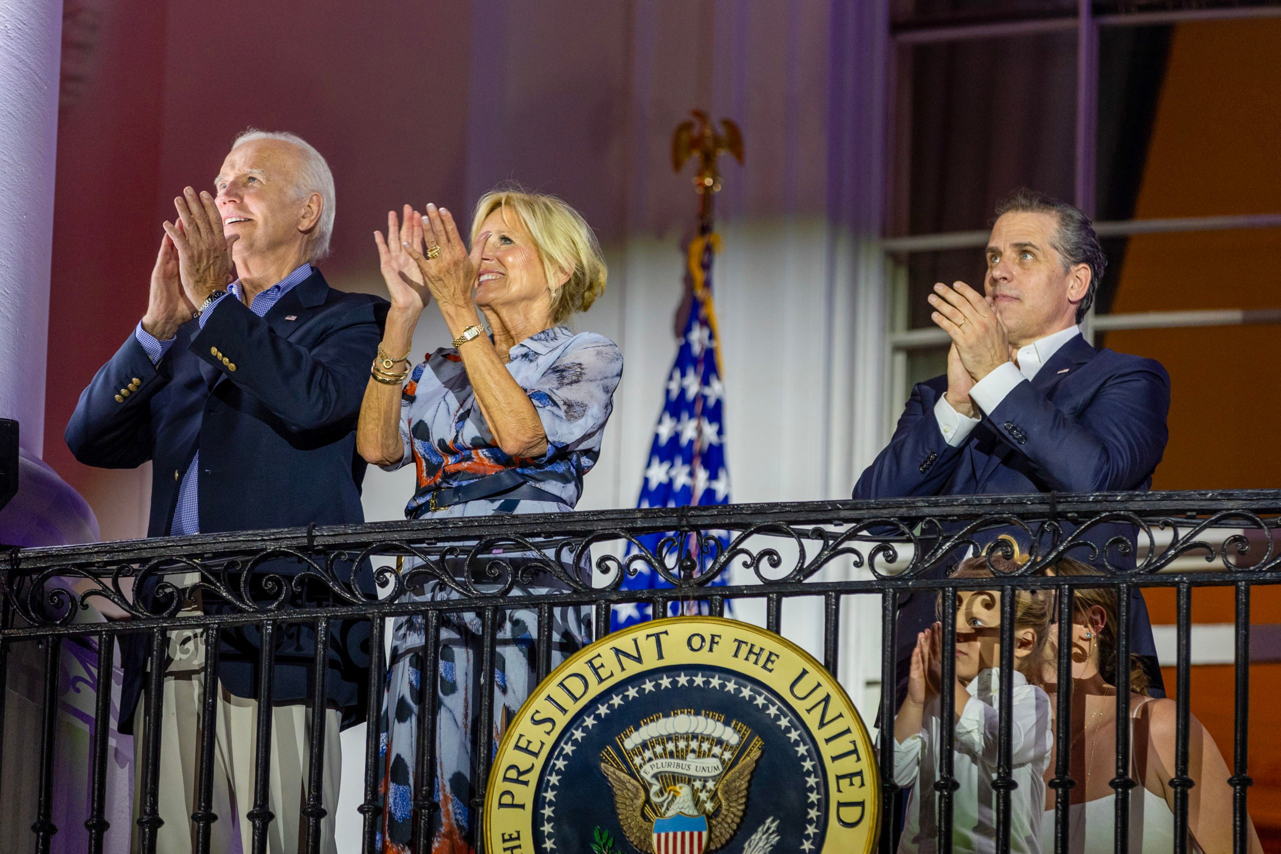 WASHINGTON, DC - JULY 04: (L-R) President Joe Biden, first lady Jill Biden and Hunter Biden watch fireworks on the South Lawn of the White House on July 04, 2023 in Washington, DC. The Bidens hosted a Fourth of July BBQ and concert with military families and other guests on the South Lawn of the White House. (Photo by Tasos Katopodis/Getty Images)