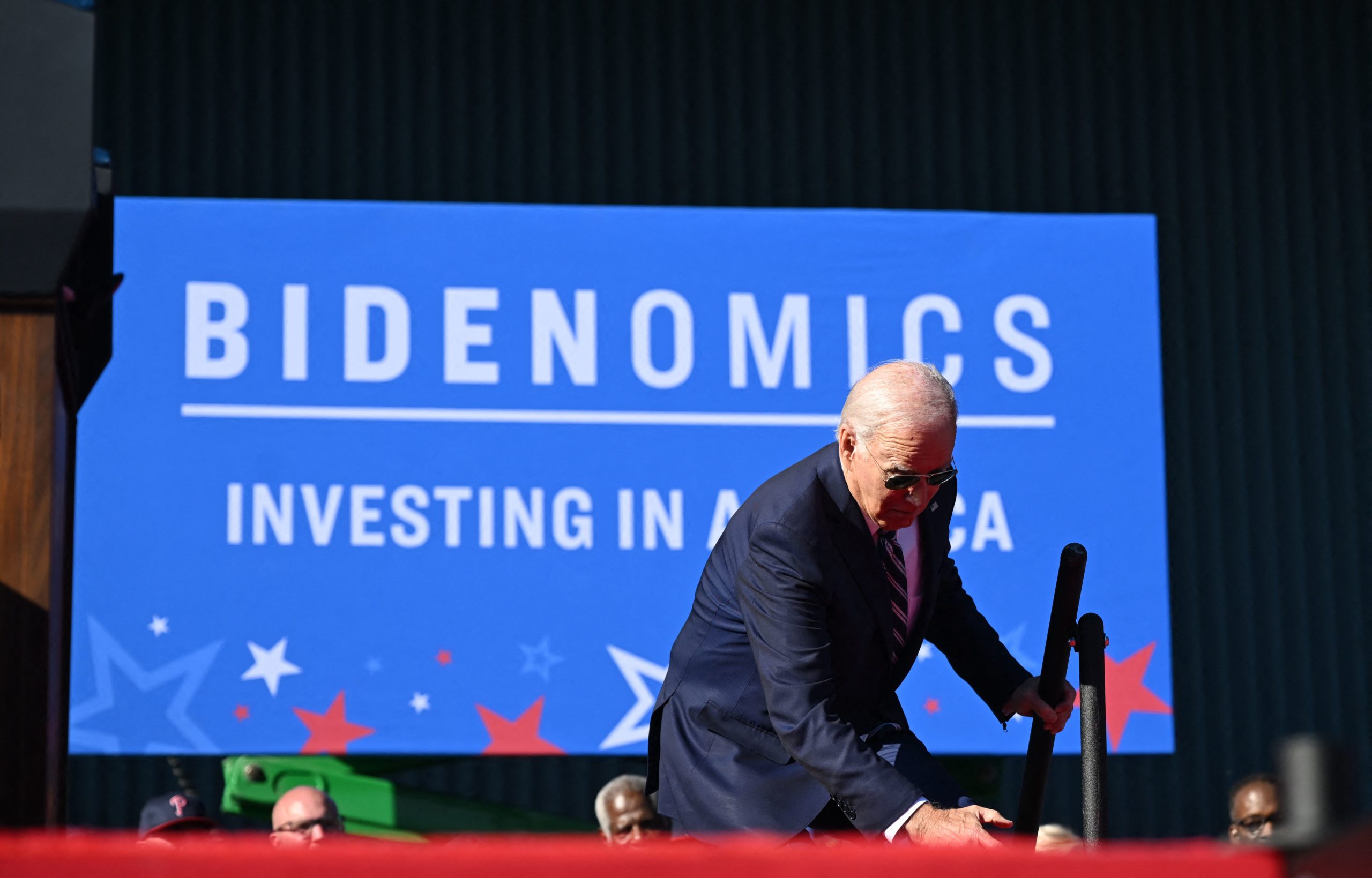  US President Joe Biden trips on the steps as he arrives on stage to speak about his Bidenomics agenda at Tioga Marine Terminal in Philadelphia, Pennsylvania, on October 13, 2023. (Photo by ANDREW CABALLERO-REYNOLDS / AFP) (Photo by ANDREW CABALLERO-REYNOLDS/AFP via Getty Images)