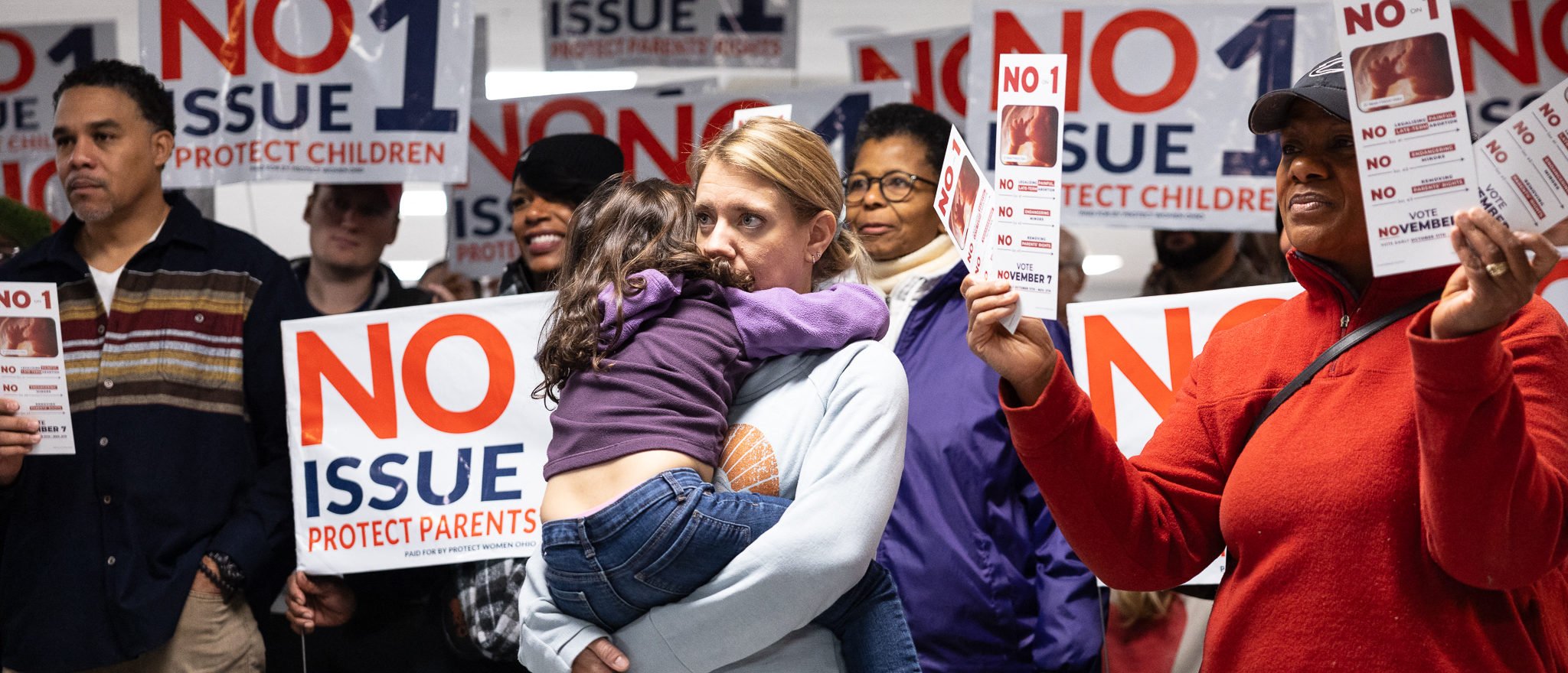 Canvassers hold pro-life signs at Columbus Christian Center ahead of Election Day during a pro-life canvasing meeting in Columbus, Ohio on November 4, 2023. (Photo by MEGAN JELINGER/AFP via Getty Images)