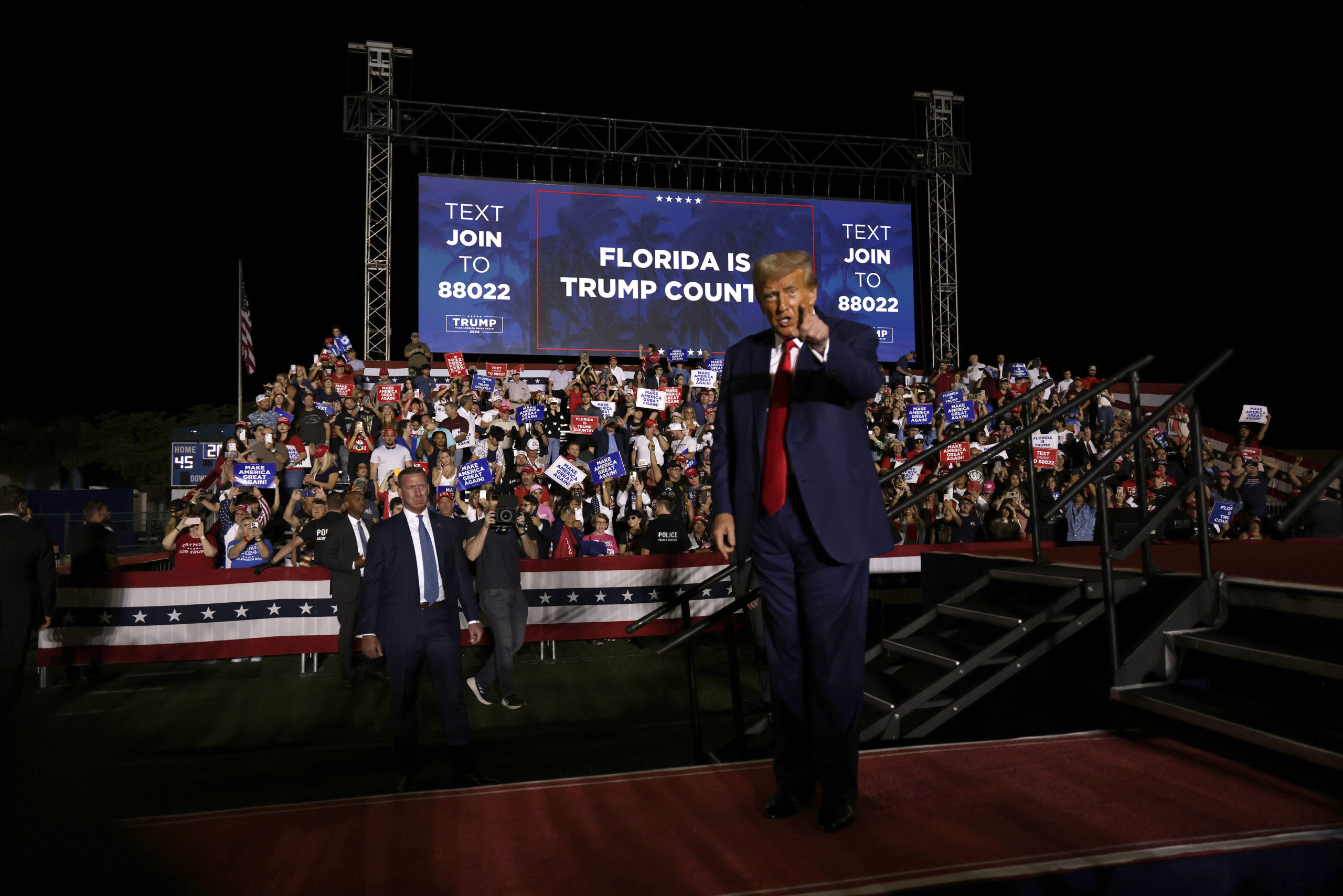 Former U.S. President Donald Trump points after delivering remarks at a campaign rally at The Ted Hendricks Stadium at Henry Milander Park on November 8, 2023 in Hialeah, Florida. Even as Trump faces multiple criminal indictments, he still maintains a commanding lead in the polls over other Republican candidates. (Photo by Alon Skuy/Getty Images)