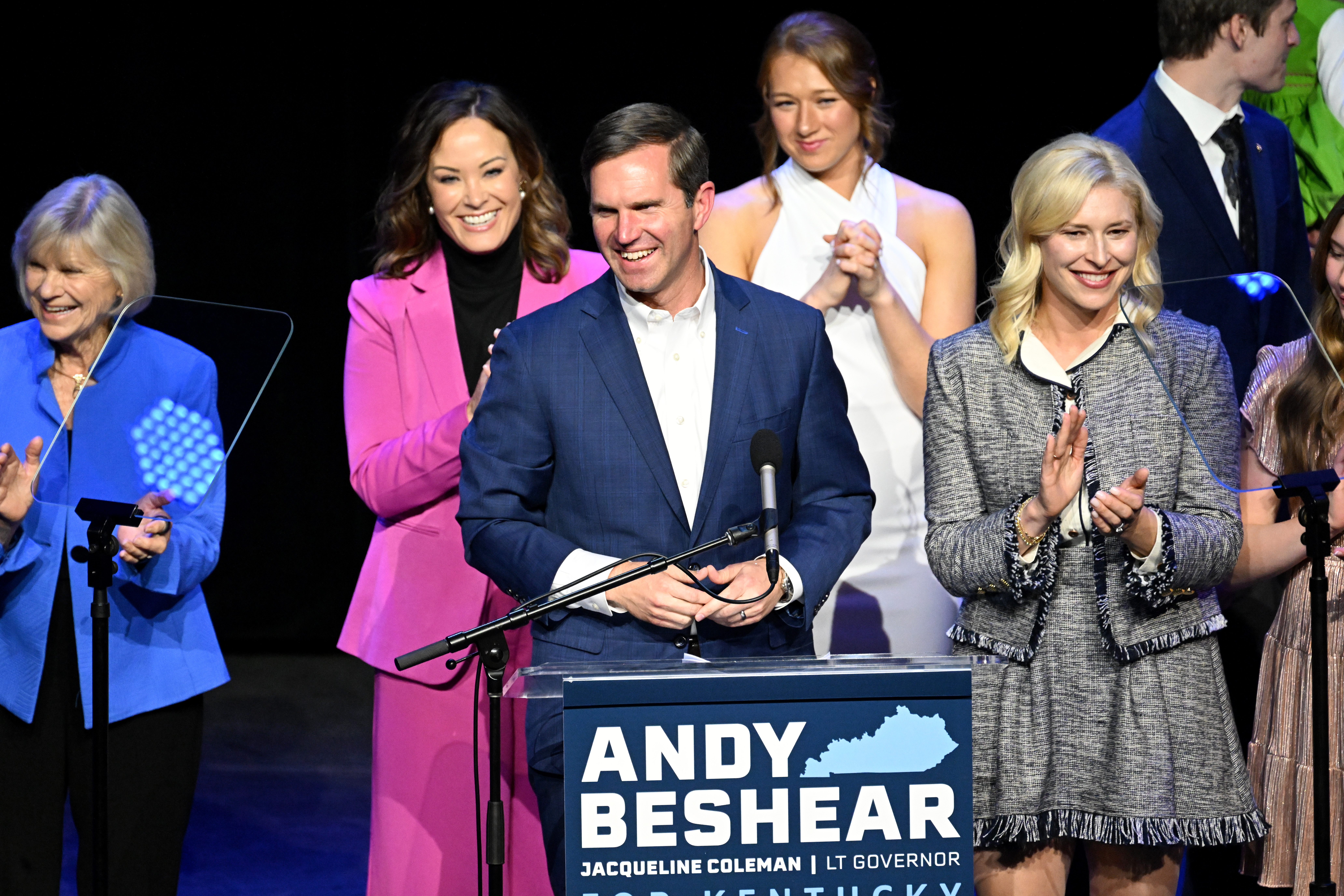 LOUISVILLE, KENTUCKY - NOVEMBER 07: Kentucky incumbent Democratic Gov. Andy Beshear is joined by his wife, Britainy Beshear (R), Kentucky Lt. Governor Jacqueline Coleman (C-L) and his family as he delivers his victory speech to a crowd at an election night event at Old Forrester's Paristown Hall on November 7, 2023 in Louisville, Kentucky. Beshear successfully defeated Republican challenger Kentucky Attorney General Daniel Cameron and will serve a second term as governor. (Photo by Stephen Cohen/Getty Images)