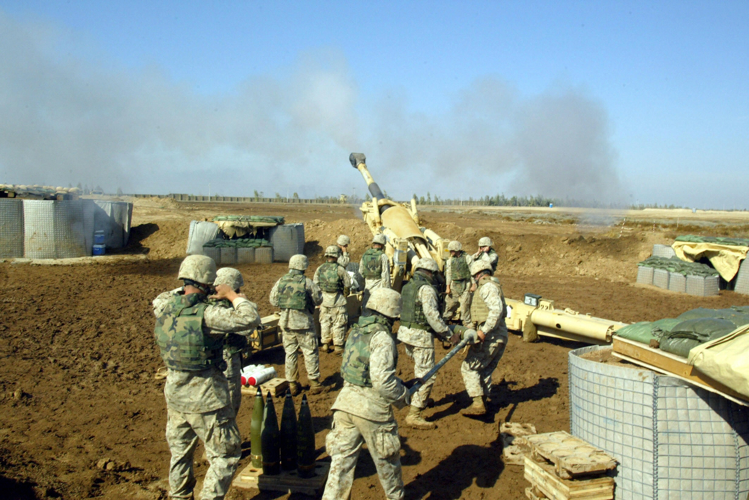 FALLUJAH, IRAQ: US Marines with 4/14 marines Mike Battery fire at insurgents in Fallujah with a 155mm Howitzer canon 09 November 2004, 50 kms west of Baghdad. US troops with crack Iraqi soldiers surged into the heart of Fallujah today in a hail of explosions and gunfire on the second day of the largest operation in Iraq since last year's US-led war. 