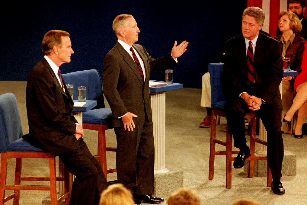 RICHMOND, VA - OCTOBER 15: U.S. presidential candidate Bill Clinton(R), and U.S. President George Bush (L) listen as Independent presidential candidate Ross Perot (C) answers a question 15 October, 1992 at the University of Richmond in Richmond, Virginia. The three met in their second of three presidential debates. (Photo credit should read J. DAVID AKE/AFP via Getty Images)