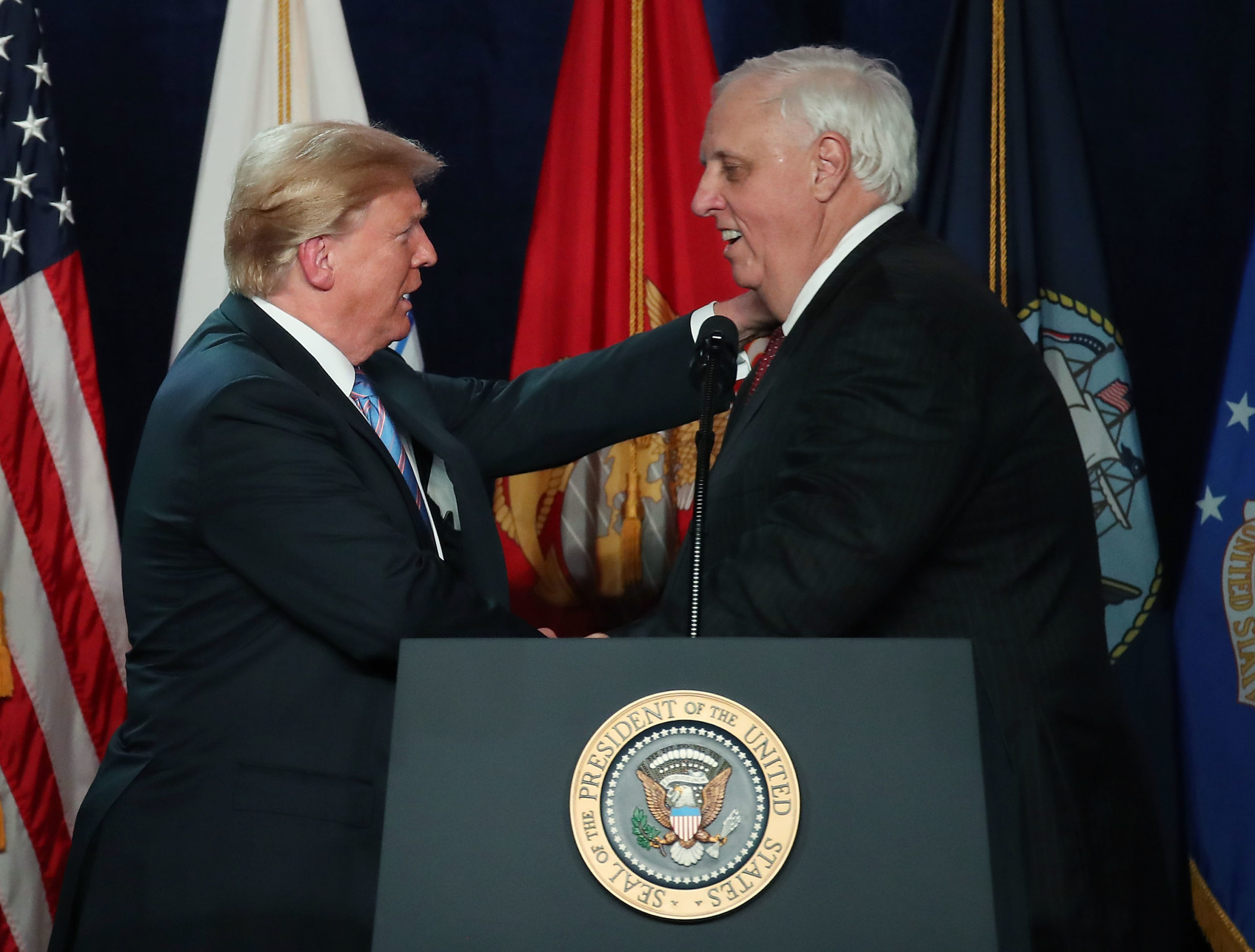 WHITE SULPHUR SPRINGS, WV - JULY 03: U.S. President Donald Trump is introduced by West Virginia Gov. Jim Justice (R) during a salute to service dinner at the Greenbrier Resort on June 3, 2018 in White Sulphur Springs, West Virginia. The president was particpating in a military tribute on the eve of Independence Day. (Photo by Mark Wilson/Getty Images)