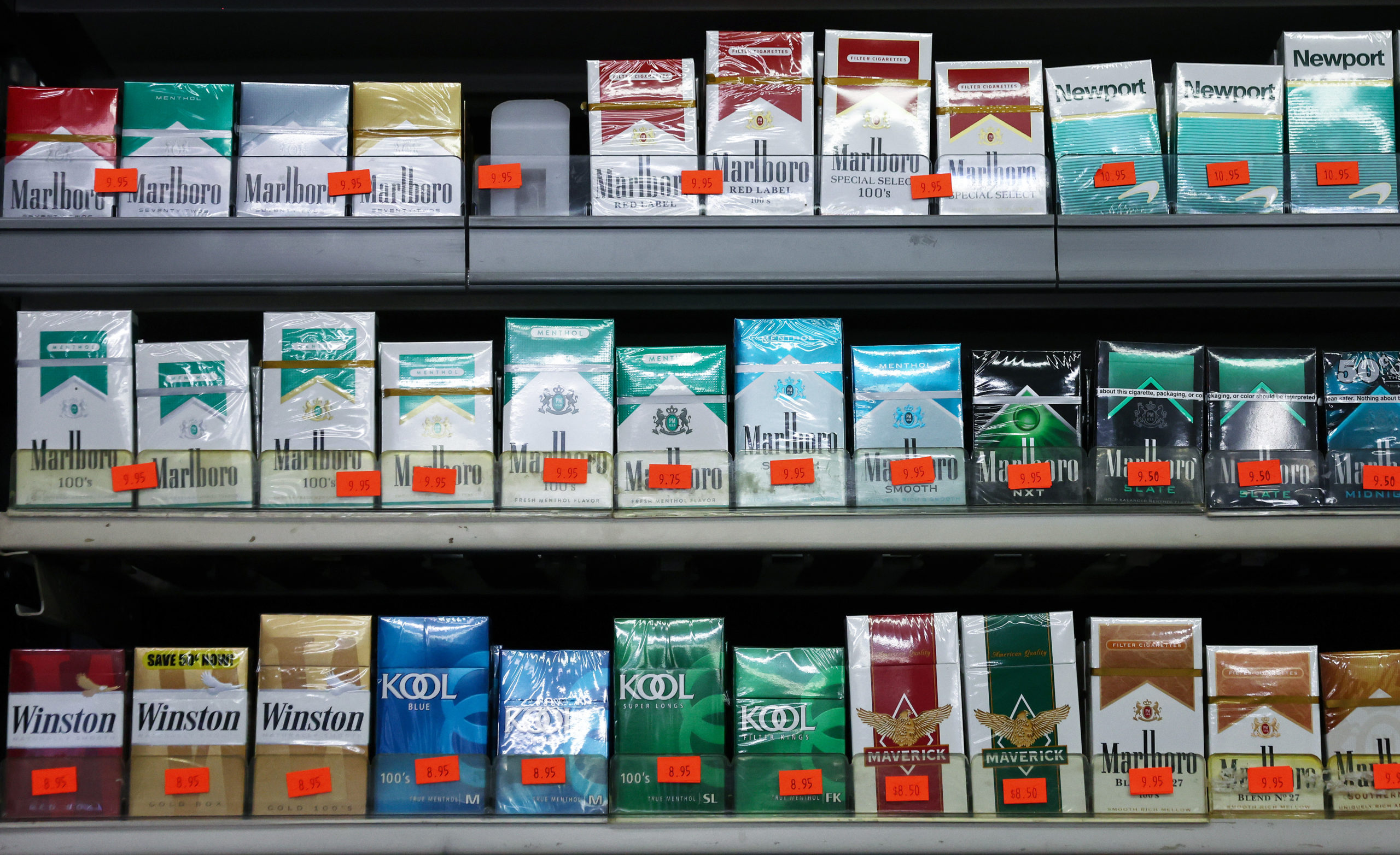 Packs of menthol-flavored and non-menthol cigarettes are displayed for sale in a smoke shop on April 28, 2022 in Los Angeles, California. The Food and Drug Administration (FDA) is proposing to ban both menthol-flavored cigarettes and flavored cigars in a move hailed by public health experts which could potentially lead to 1.3 million people quitting smoking. (Photo by Mario Tama/Getty Images)