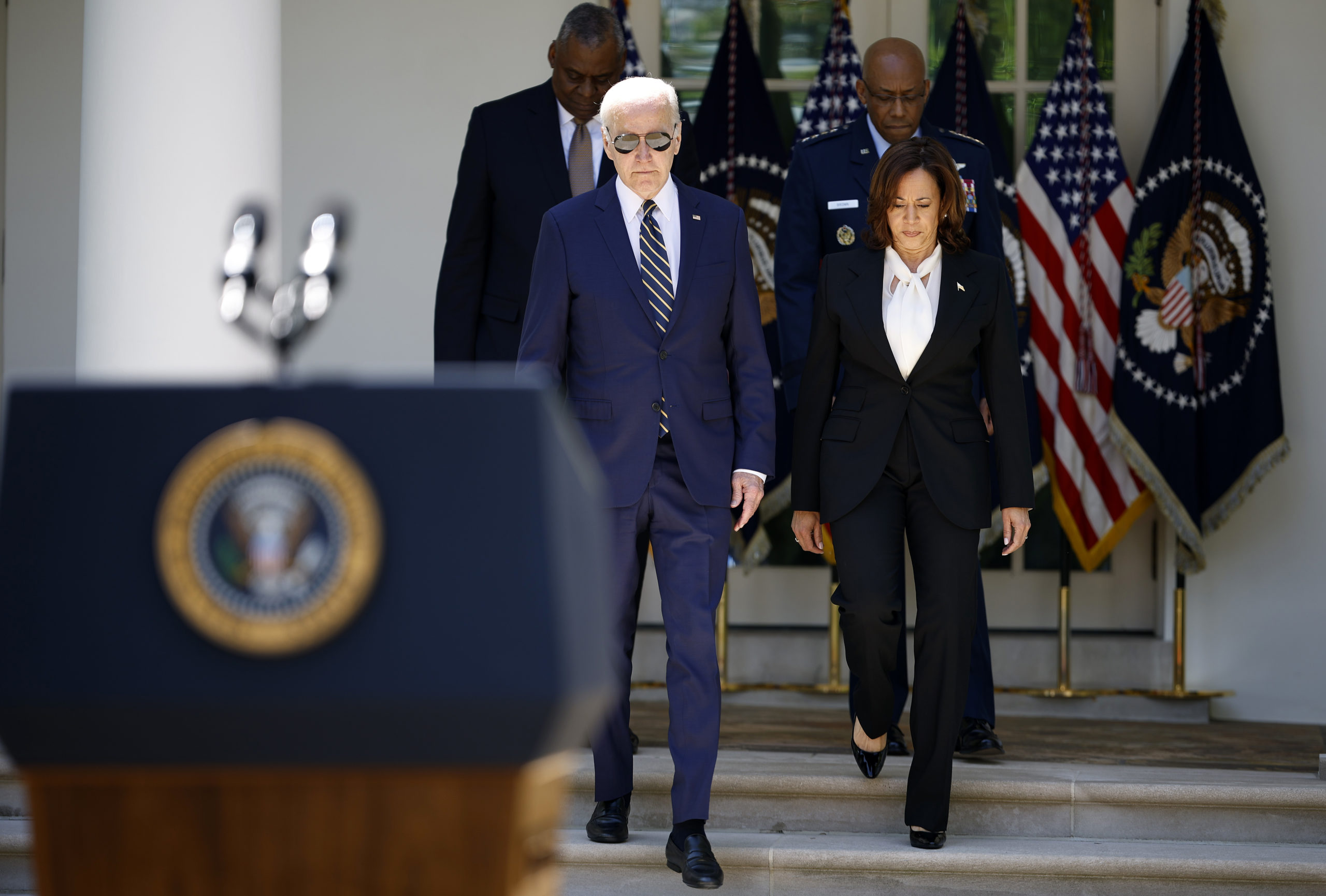 U.S. President Joe Biden, Gen. Charles Q. Brown, Jr., (back right), Vice President Kamala Harris and Secretary of Defense Lloyd Austin arrive for an event where Biden announced his intent to nominate Brown to serve as the next Chairman of the Joint Chiefs of Staff in the Rose Garden of the White House May 25, 2023 in Washington, DC. Brown is currently serving as the U.S. Air Force Chief of Staff. If confirmed by the Senate, Brown would be second African-American man, after Colin Powell, to hold the position of Chairman of the Joint Chiefs of Staff, the most senior military adviser to the president. (Photo by Kevin Dietsch/Getty Images)