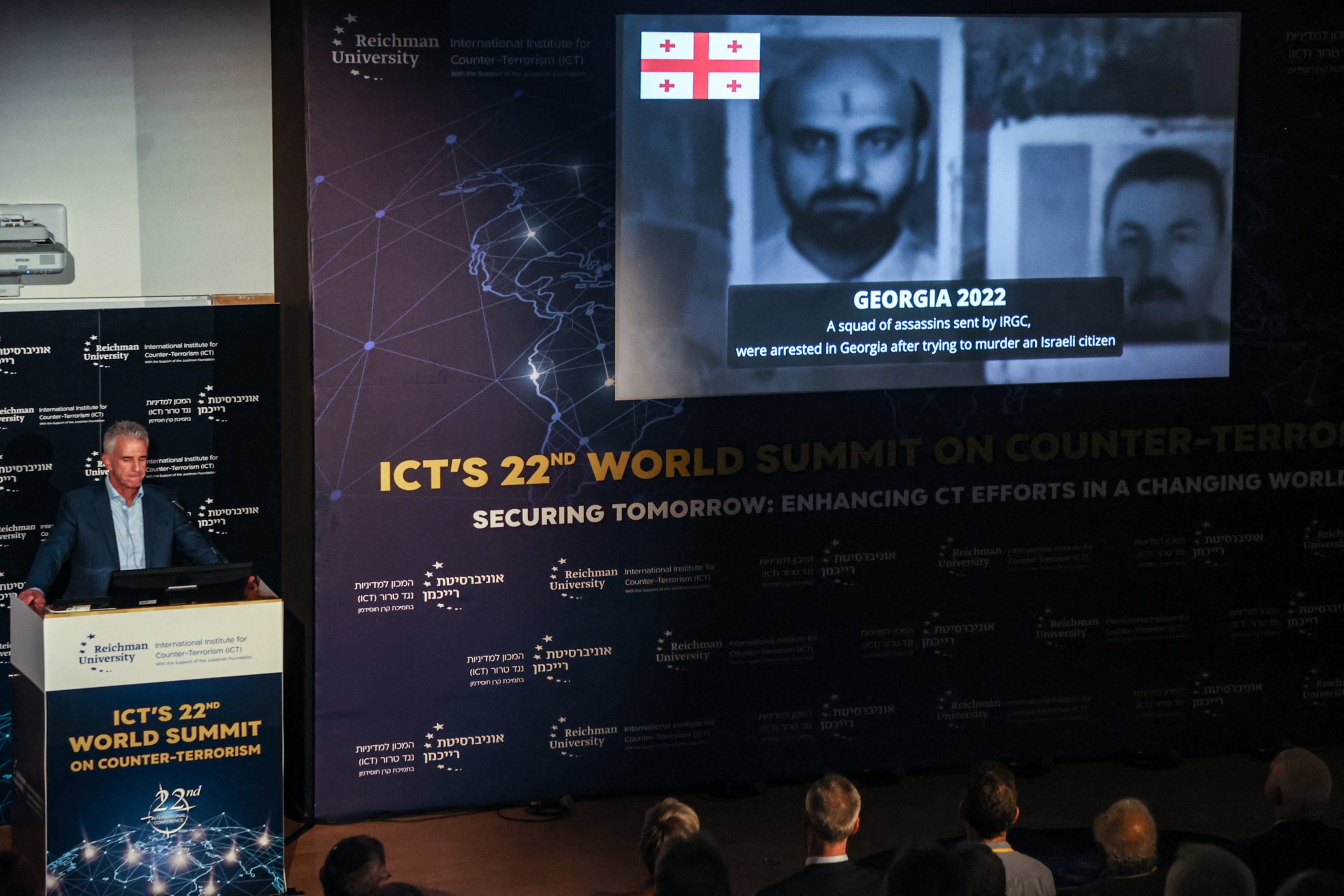 Israel's Mossad Director David Barnea speaks on the backdrop of a video claiming to show Iranian intelligence operatives, during the International Institute for Counter-Terrorism (ICT) World Summit in the central coastal city of Herzliya on September 10, 2023.