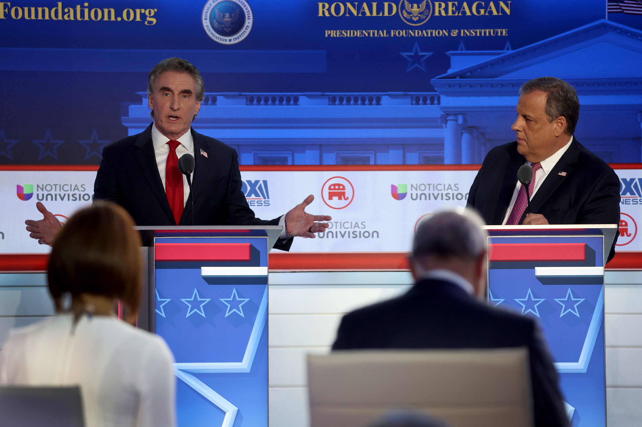 SIMI VALLEY, CALIFORNIA - SEPTEMBER 27: Republican presidential candidates (L-R), North Dakota Gov. Doug Burgum and former New Jersey Gov. Chris Christie participate in the FOX Business Republican Primary Debate at the Ronald Reagan Presidential Library on September 27, 2023 in Simi Valley, California. Seven presidential hopefuls squared off in the second Republican primary debate as former U.S. President Donald Trump, currently facing indictments in four locations, declined again to participate. (Photo by Justin Sullivan/Getty Images)