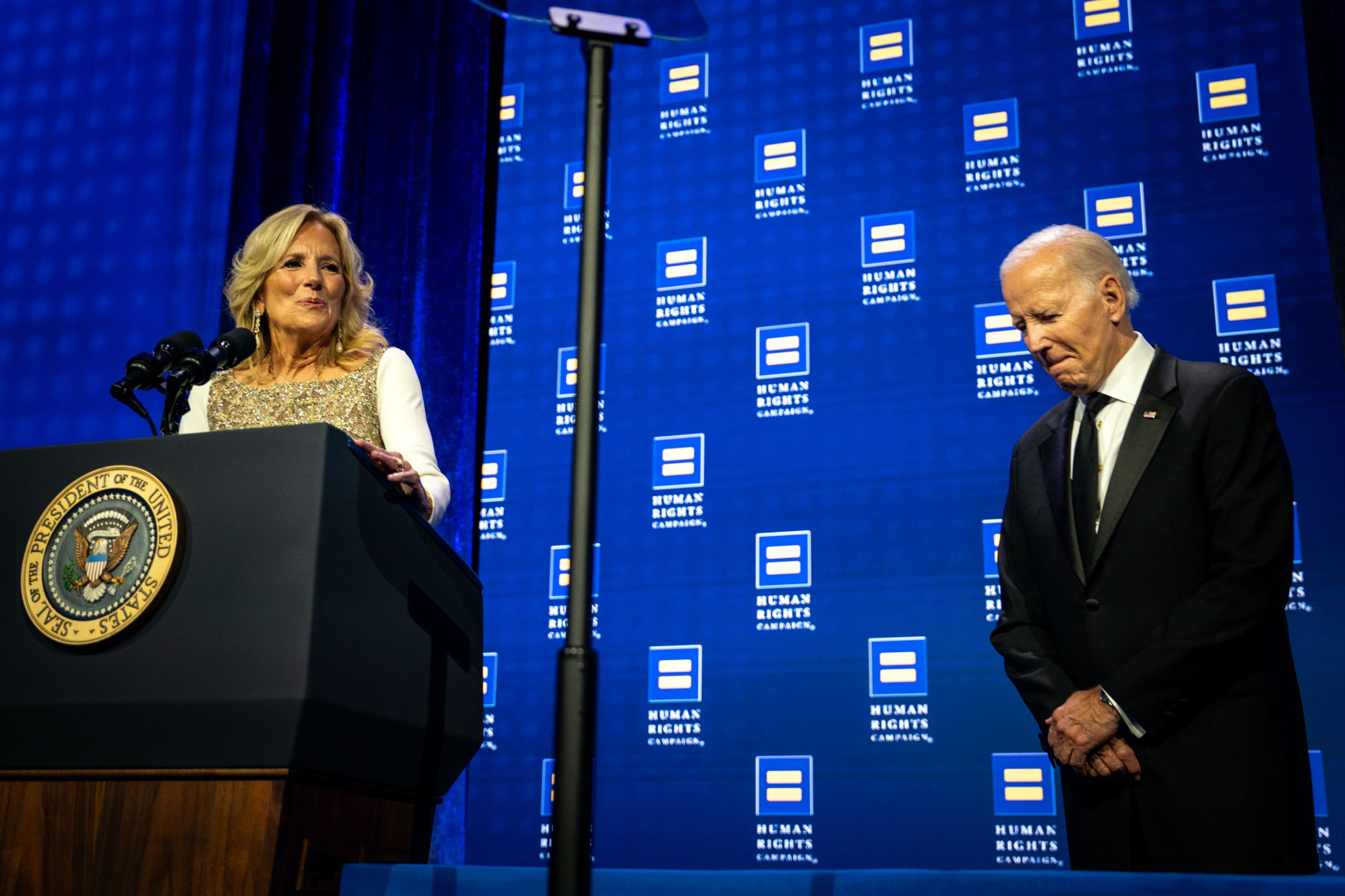 US President Joe Biden listens as First Lady Jill Biden delivers remarks during the 2023 Human Rights Campaign National Dinner at the Washington Convention Center on October, 14, 2023 in Washington, DC. (Photo by Kent Nishimura/Getty Images)