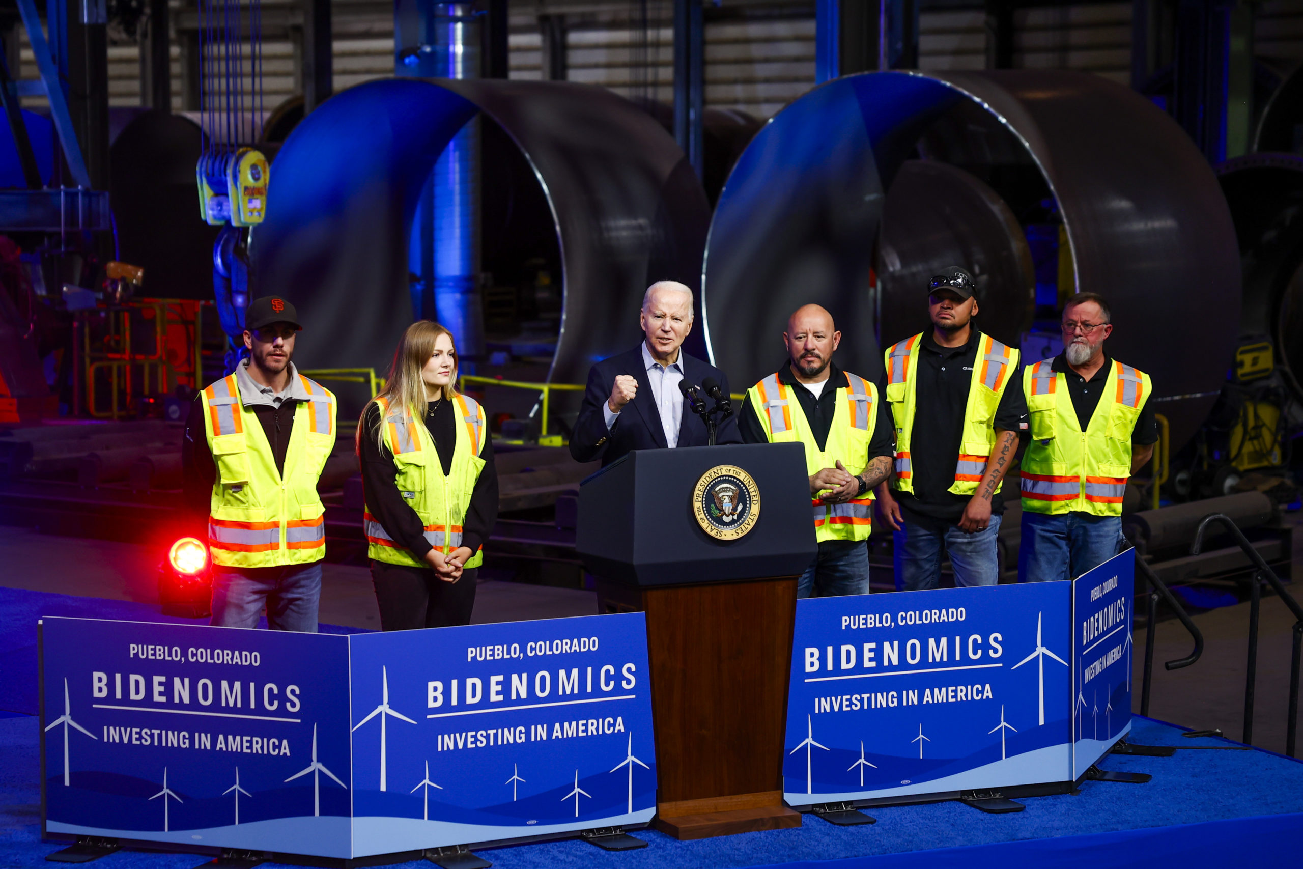 Standing next to CS Wind employees, US President Joe Biden speaks about Bidenomics at CS Wind on November 29, 2023 in Pueblo, Colorado. CS Wind, the largest wind turbine tower manufacturer in the world, recently announced they were expanding operations as a direct result of the Inflation Reduction Act. (Photo by Michael Ciaglo/Getty Images)