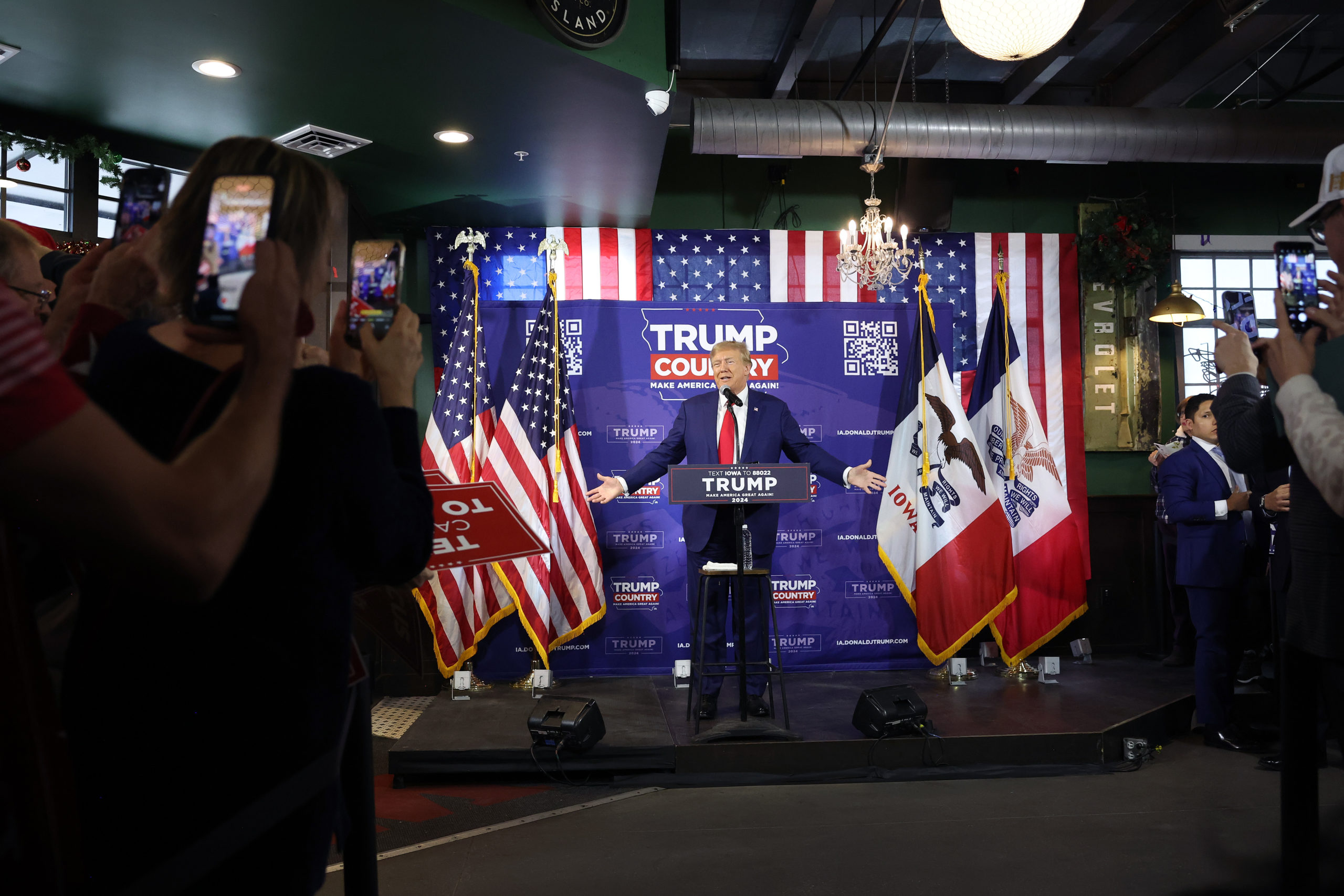 Republican presidential candidate former President Donald Trump speaks at a commit to caucus campaign event at the Whiskey River bar on December 02, 2023 in Ankeny, Iowa. Iowa Republicans will be the first to select their party's nominee for president when they go to caucus on January 15, 2024. (Photo by Scott Olson/Getty Images)