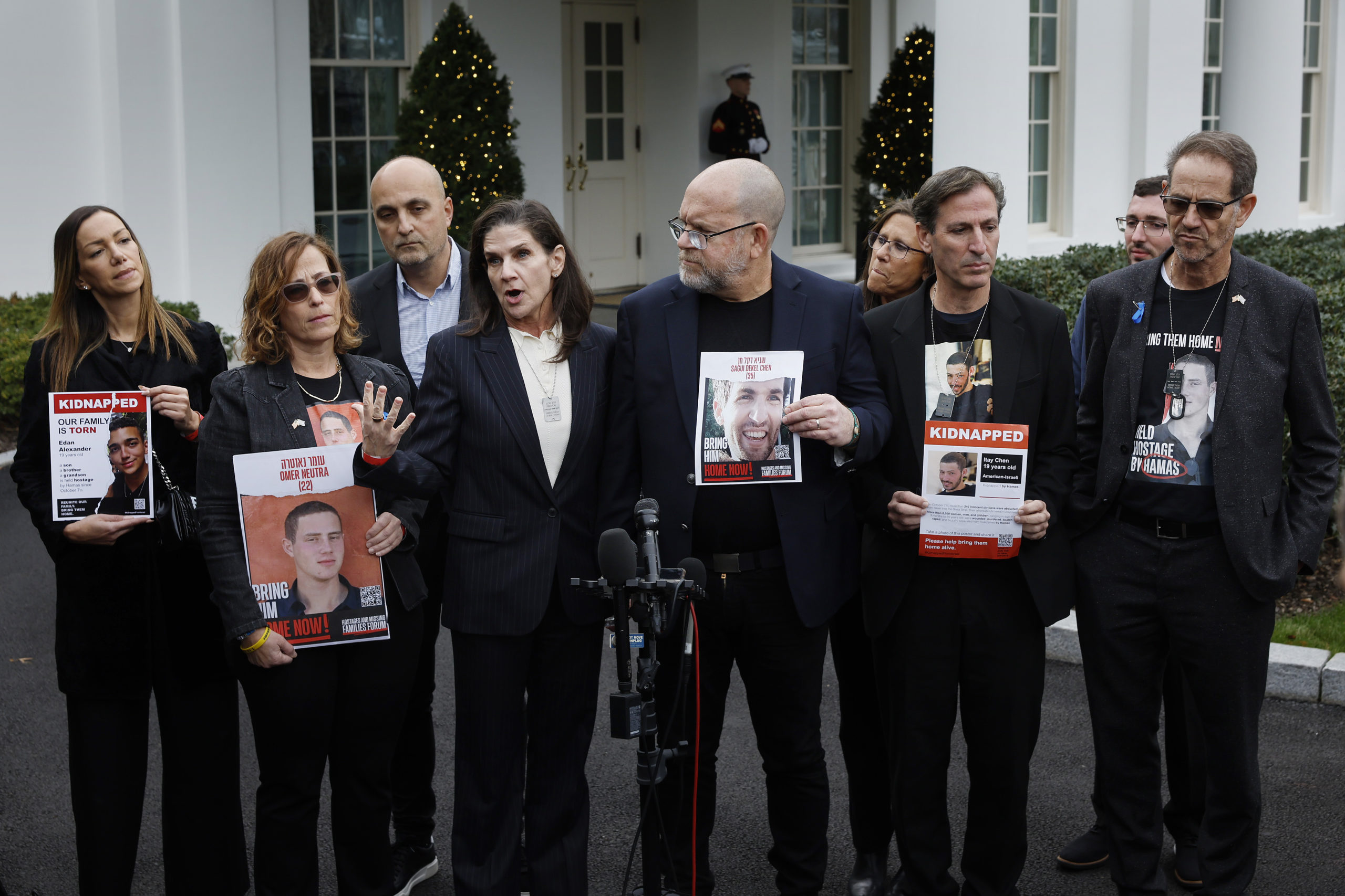 Family members of Americans who were taken hostage by Hamas during the terrorist attacks in Israel on October 7, including (R-L) Ronen Neutra, Ruby Chen, Jonathan Dekel-Chen, Liz Naftali, Adi Alexander, Orna Neutra, and Yael Alexander talk to reporters outside the West Wing of the White House on December 13, 2023 in Washington, DC. The families were invited to a private meeting with U.S. President Joe Biden and Secretary of State Antony Blinken. (Photo by Chip Somodevilla/Getty Images)