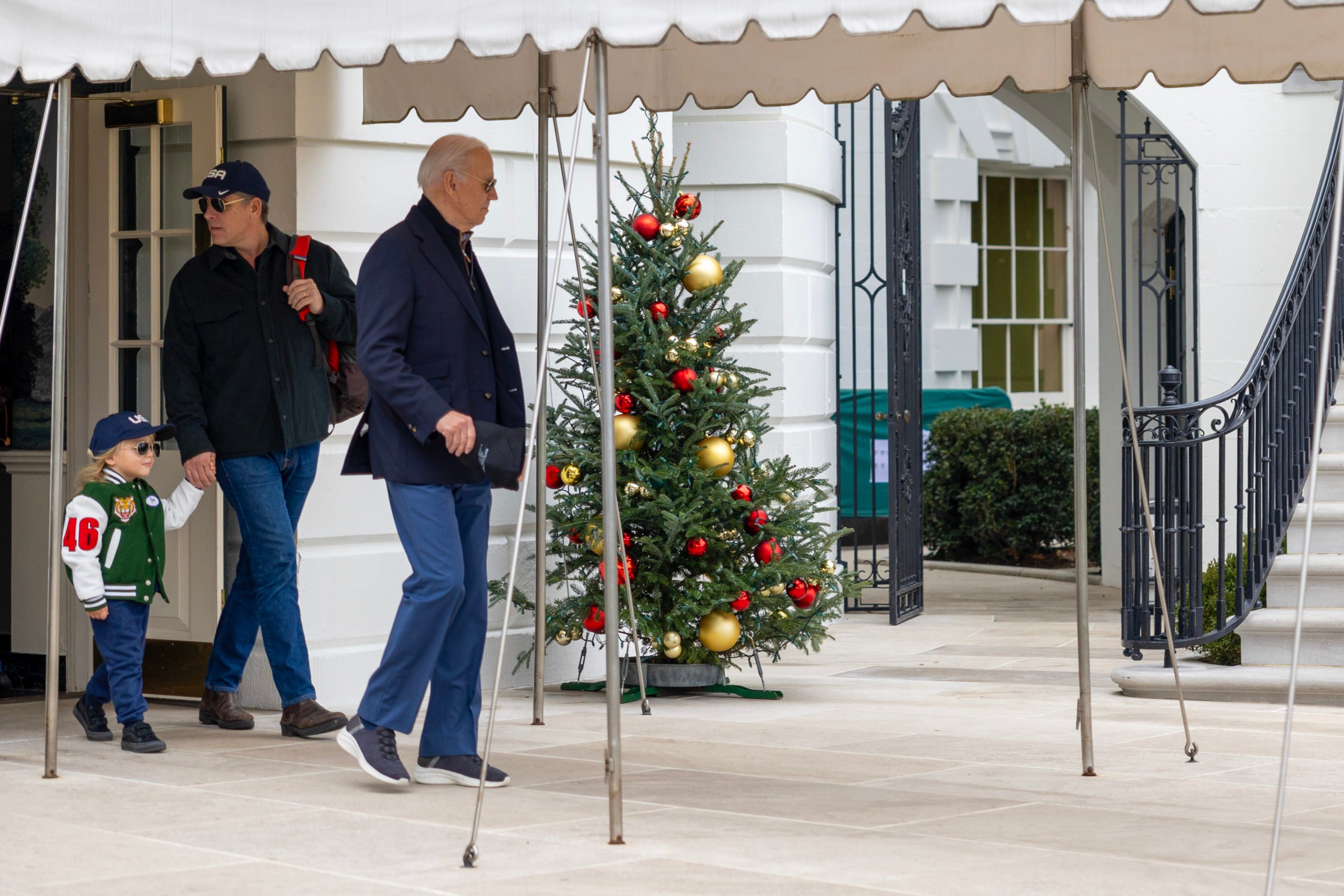 U.S. President Joe Biden walks out of the White House alongside Hunter Biden and his son Beau Biden towards Marine One on December 23, 2023 in Washington, DC. President Biden will spend the holidays with family at Camp David. (Photo by Tasos Katopodis/Getty Images)