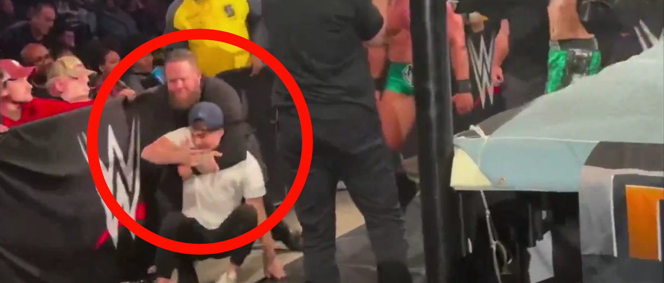 Video Shows WWE Fan Getting Choked Out And Completely Manhandled After Trying To Attack A Couple Of Superstars