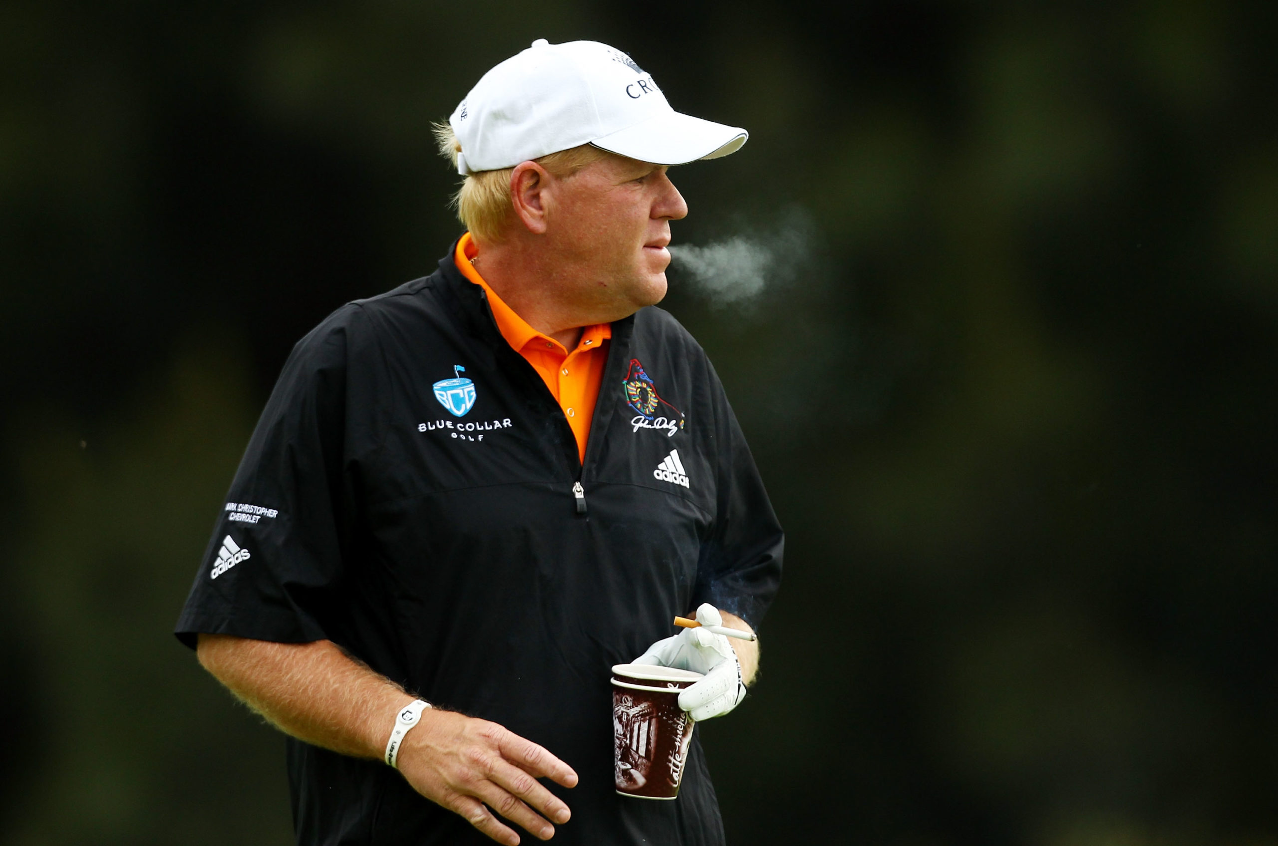SYDNEY, AUSTRALIA - DECEMBER 02: John Daly of the United States smokes on the 14th hole during day one of the Australian Open at The Lakes Golf Club on December 2, 2010 in Sydney, Australia. Mark Nolan/Getty Images