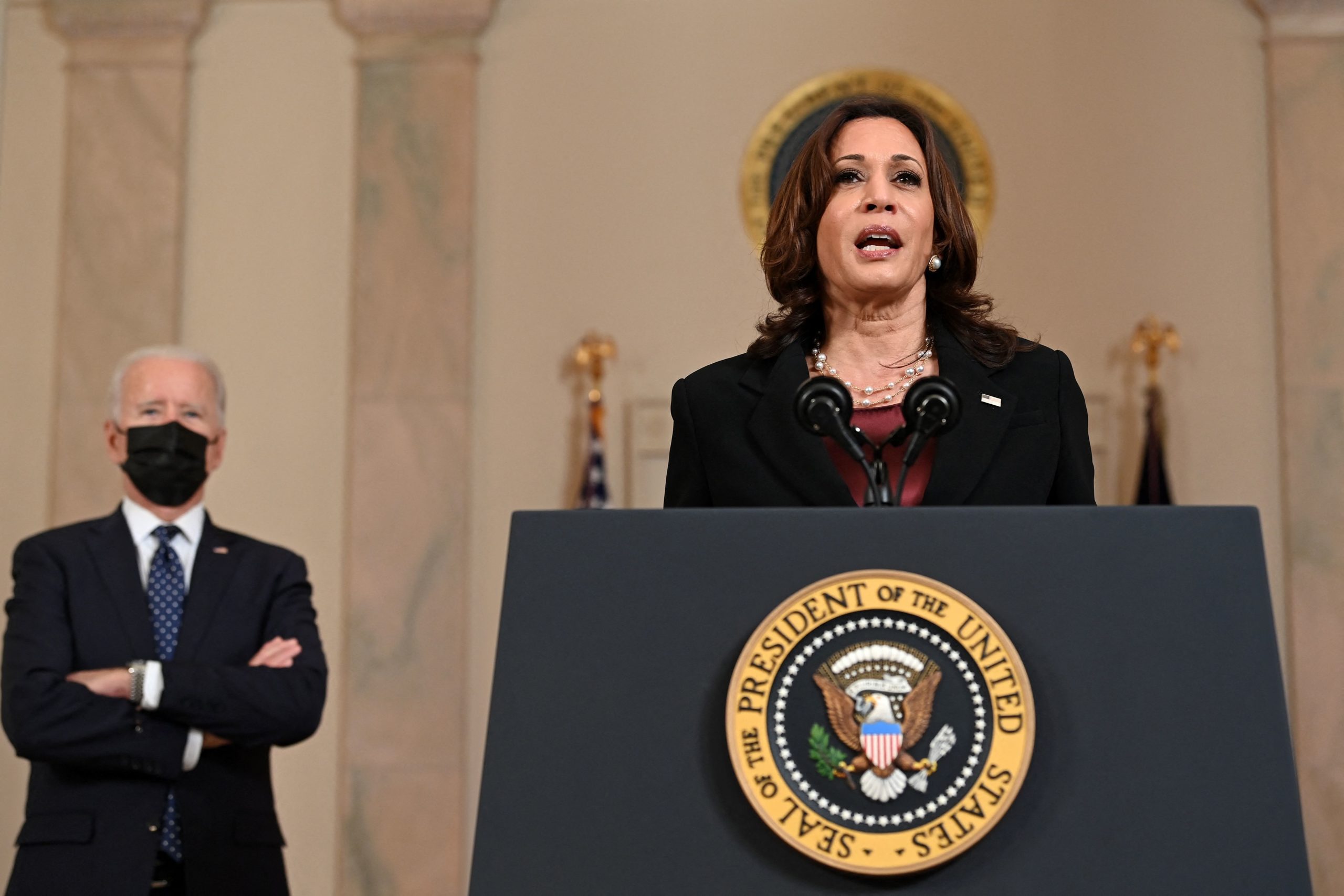 US President Joe Biden (L) listens as Vice President Kamala Harris delivers remarks on the guilty verdict against former policeman Derek Chauvin at the White House in Washington, DC, on April 20, 2021. - Derek Chauvin, a white former Minneapolis police officer, was convicted on April 20 of murdering African-American George Floyd after a racially charged trial that was seen as a pivotal test of police accountability in the United States. (Photo by Brendan SMIALOWSKI / AFP) (Photo by BRENDAN SMIALOWSKI/AFP via Getty Images)
