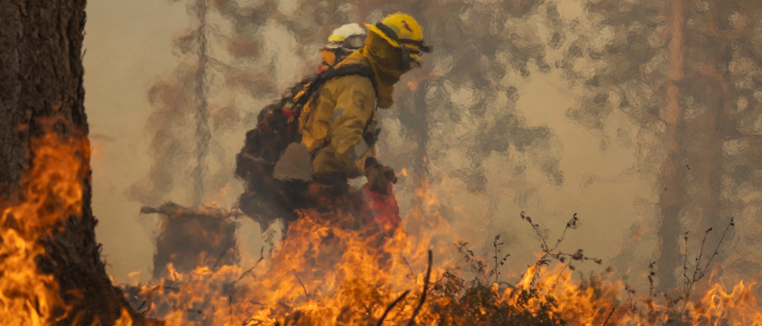 TOPSHOT - A firefighter lights a backfire while fighting the Oak Fire on near Mariposa, California, on July 24, 2022. - The fierce California wildfire expanded early Sunday burning several thousand acres and forcing evacuations, as tens of millions of Americans sweltered through scorching heat with already record-setting temperatures due to climb even further. More than 2,000 firefighters backed by 17 helicopters have been deployed against the Oak Fire, which broke out Friday near Yosemite National Park, the California Department of Forestry and Fire Protection (CAL FIRE) said in a report. (Photo by DAVID MCNEW / AFP) (Photo by DAVID MCNEW/AFP via Getty Images)