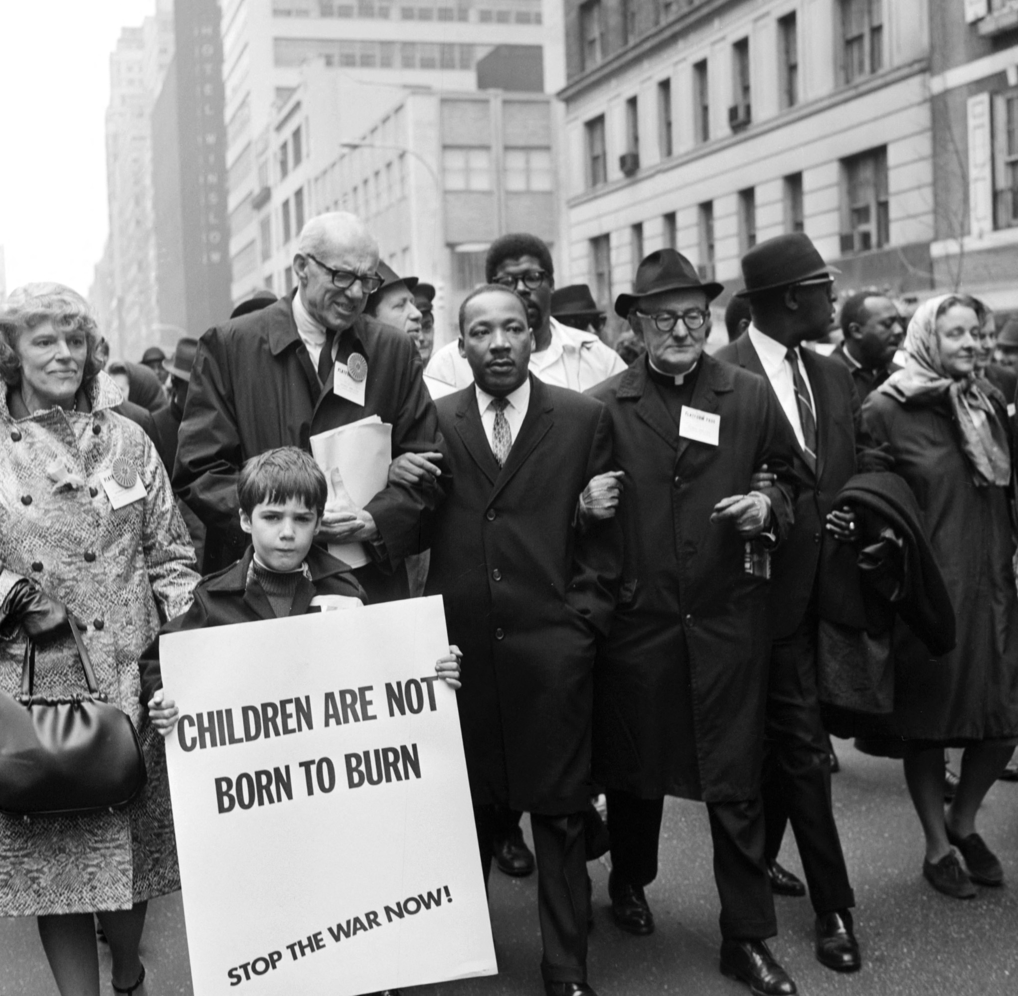 Civil rights leader Rev. Martin Luther King, Jr., (C) is accompanied by famed pediatrician Dr. Benjamin Spock (2nd-L), Father Frederick Reed (3rd-R) and union leader Cleveland Robinson (2nd-R) 16 March, 1967, during an anti-Vietnam War demonstration in New York. The US is celebrating in 2004 what would have been King's 75th birthday. King was assassinated on 04 April, 1968, in Memphis, Tennessee. (Photo: AFP via Getty Images)