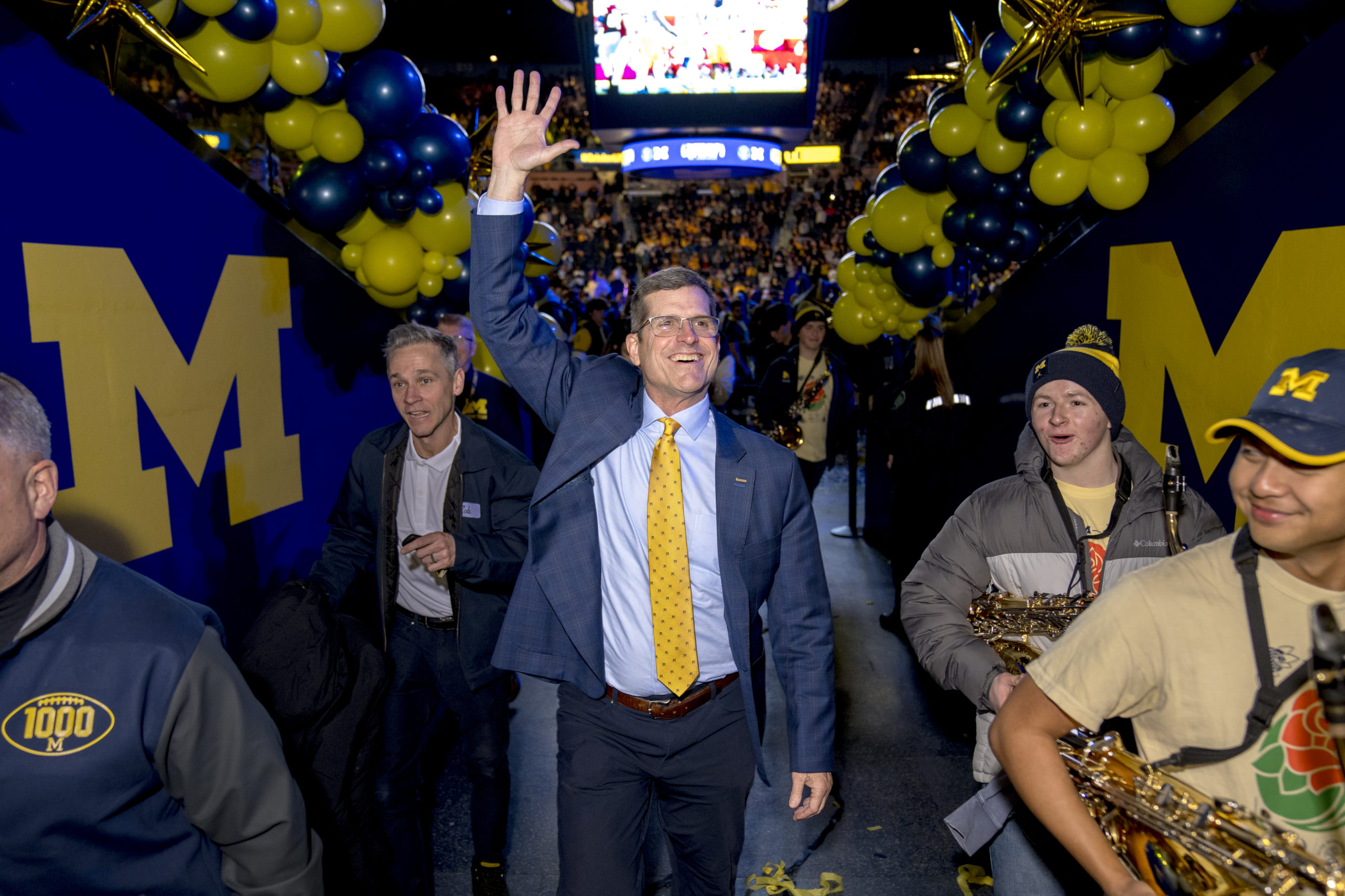 ANN ARBOR, MICHIGAN - JANUARY 13: Head coach Jim Harbaugh of the Michigan Wolverines waves to fans after the Michigan Wolverines football National Championship celebration on January 13, 2024 at Crisler Center in Ann Arbor, Michigan. Nic Antaya/Getty Images