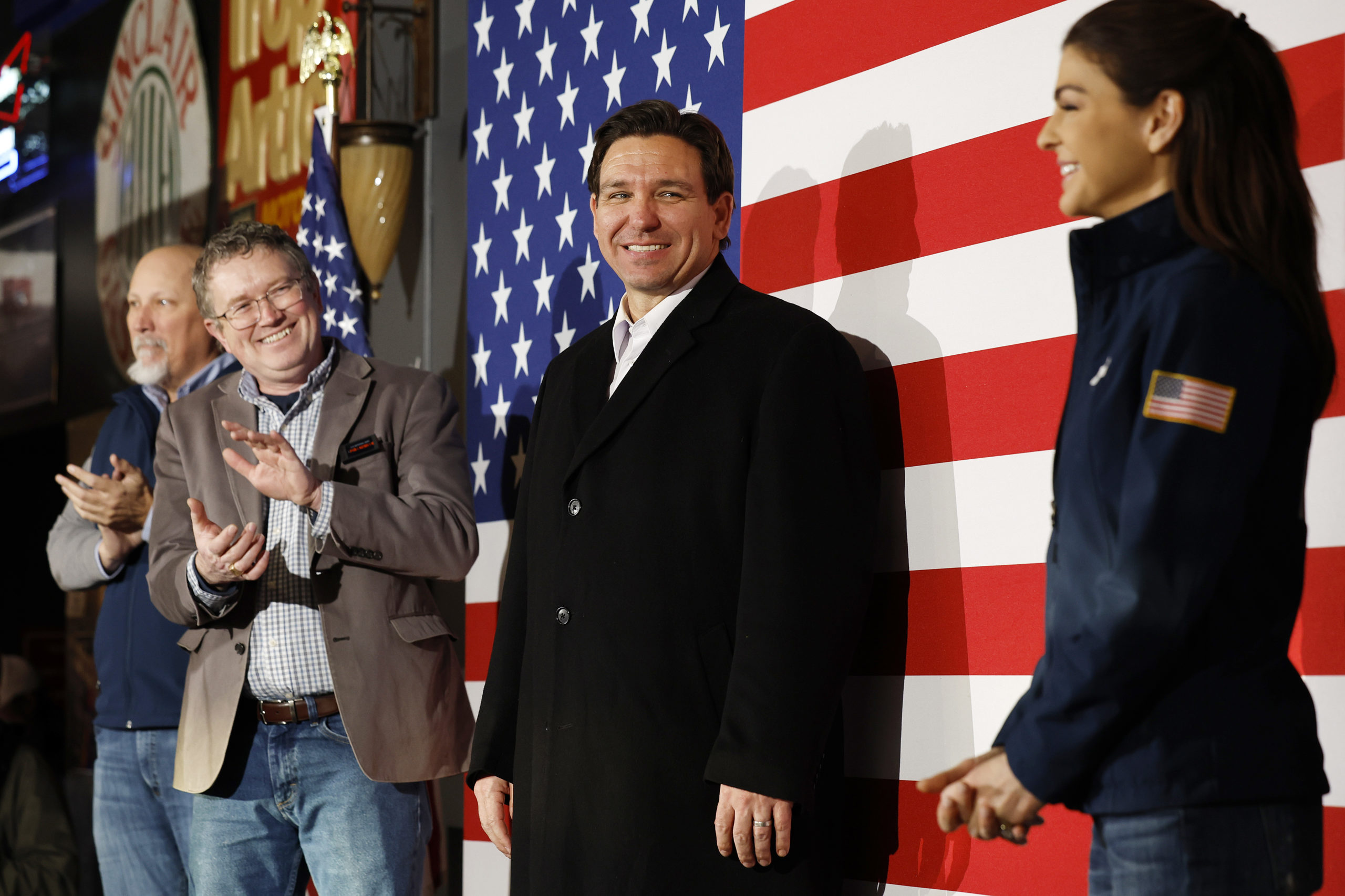 Republican presidential candidate Florida Gov. Ron DeSantis looks at his wife Casey DeSantis at a campaign event at the Chrome Horse Saloon as Rep. Chip Roy (R-TX) and Rep. Thomas Massie (R-KY) look on, January 14, 2024 in Cedar Rapids, Iowa. Iowa Republicans will be the first to select their party's nominee for the 2024 presidential race when they go to caucus tomorrow. (Photo by Chip Somodevilla/Getty Images)