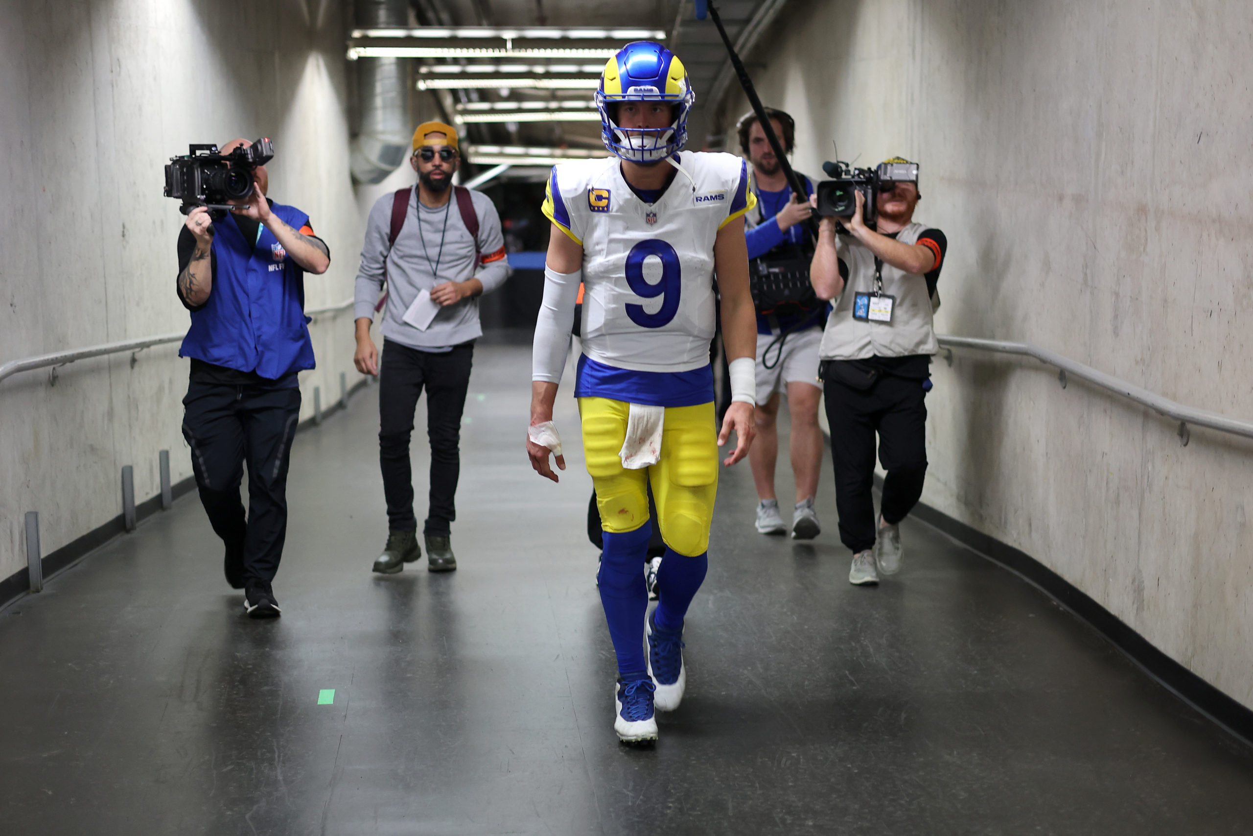DETROIT, MICHIGAN - JANUARY 14: Matthew Stafford #9 of the Los Angeles Rams walks to the locker room after being defeated by the Detroit Lions 24-23 in the NFC Wild Card Playoffs at Ford Field on January 14, 2024 in Detroit, Michigan. Rey Del Rio/Getty Images