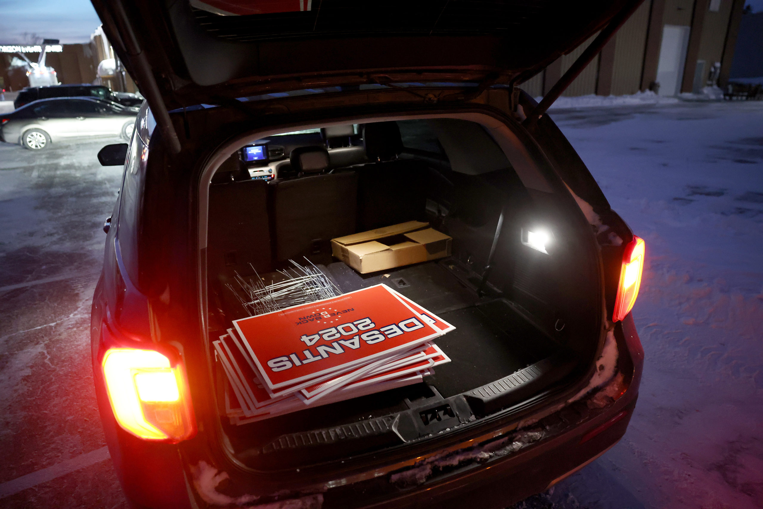 Ron DeSantis campaign signs sit in the back of a car outside a caucus site at the Horizon Events Center on January 15, 2024 in Clive, Iowa. Iowans vote today in the state’s caucuses for the first contest in the 2024 Republican presidential nominating process. (Photo by Kevin Dietsch/Getty Images)