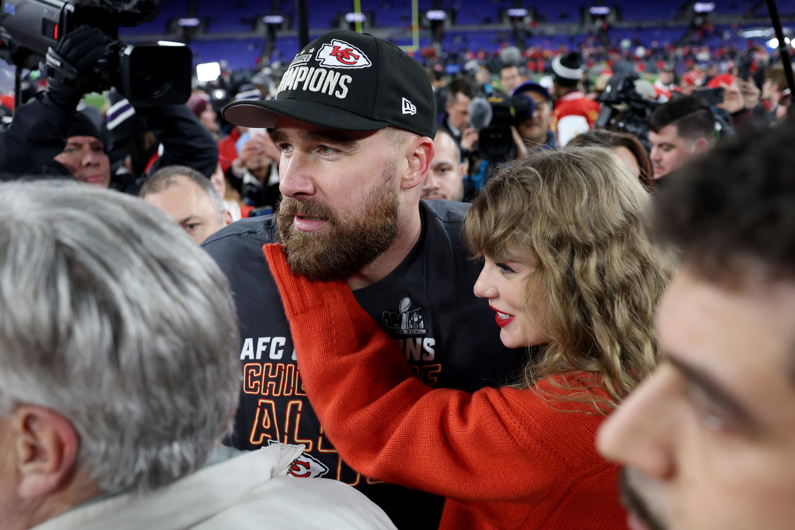 BALTIMORE, MARYLAND - JANUARY 28: Travis Kelce #87 of the Kansas City Chiefs celebrates with Taylor Swift after a 17-10 victory against the Baltimore Ravens in the AFC Championship Game at M&T Bank Stadium on January 28, 2024 in Baltimore, Maryland. Patrick Smith/Getty Images