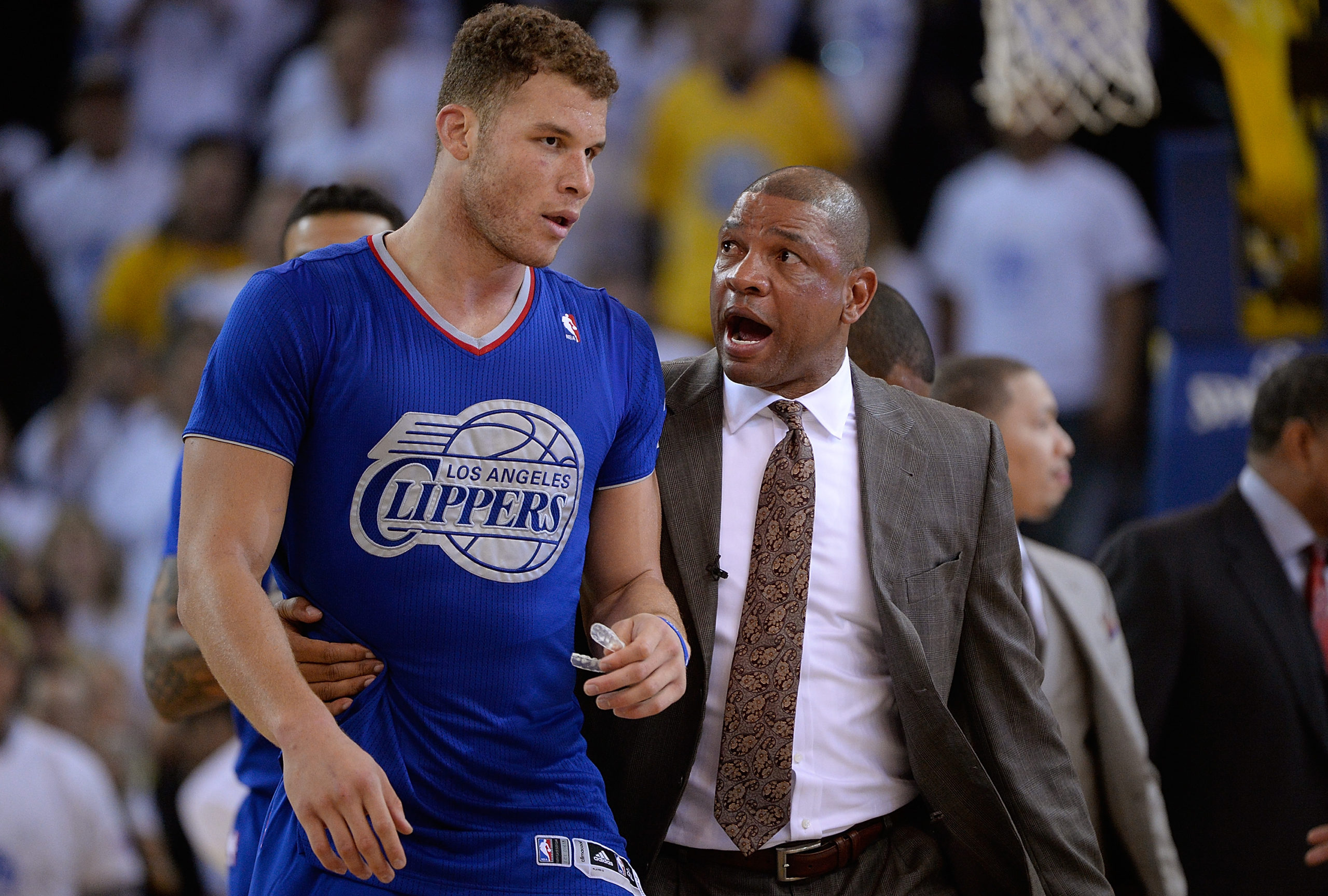 OAKLAND, CA - DECEMBER 25: Head Coach Doc Rivers of the Los Angeles Clippers comes out on the court to get Blake Griffin #32 who was ejected for his second flagrant foul against the Golden State Warriors during the fourth quarter at ORACLE Arena on December 25, 2013 in Oakland, California. Thearon W. Henderson/Getty Images