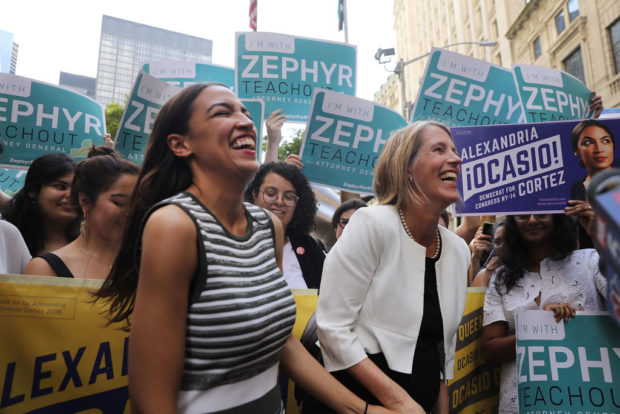 NEW YORK, NY - JULY 12: Congressional nominee Alexandria Ocasio-Cortez (L) stands with Zephyr Teachout after endorsing her for New York City Public Advocate on July 12, 2018 in New York City. The two liberal candidates held the news conference in front of the Wall Street bull in a show of standing up to corporate money. Ocasio-Cortez shocked the Democratic political community recently after an upset win against Representative Joe Crowley in the New York Democratic primary. (Photo by Spencer Platt/Getty Images)