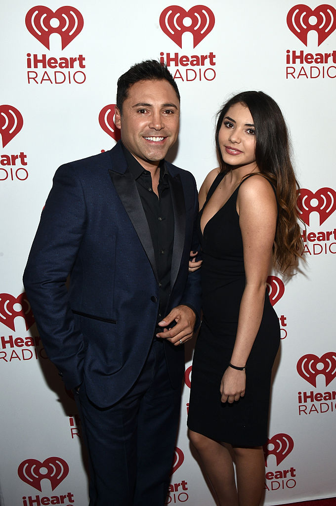INGLEWOOD, CA - NOVEMBER 22: Professional Boxer Oscar De La Hoya (L) poses with daughter Atiana de la Hoya backstage during the iHeartRadio Fiesta Latina festival presented by Sprint at The Forum on November 22, 2014 in Inglewood, California. (Photo by Michael Buckner/Getty Images for iHeartMedia)