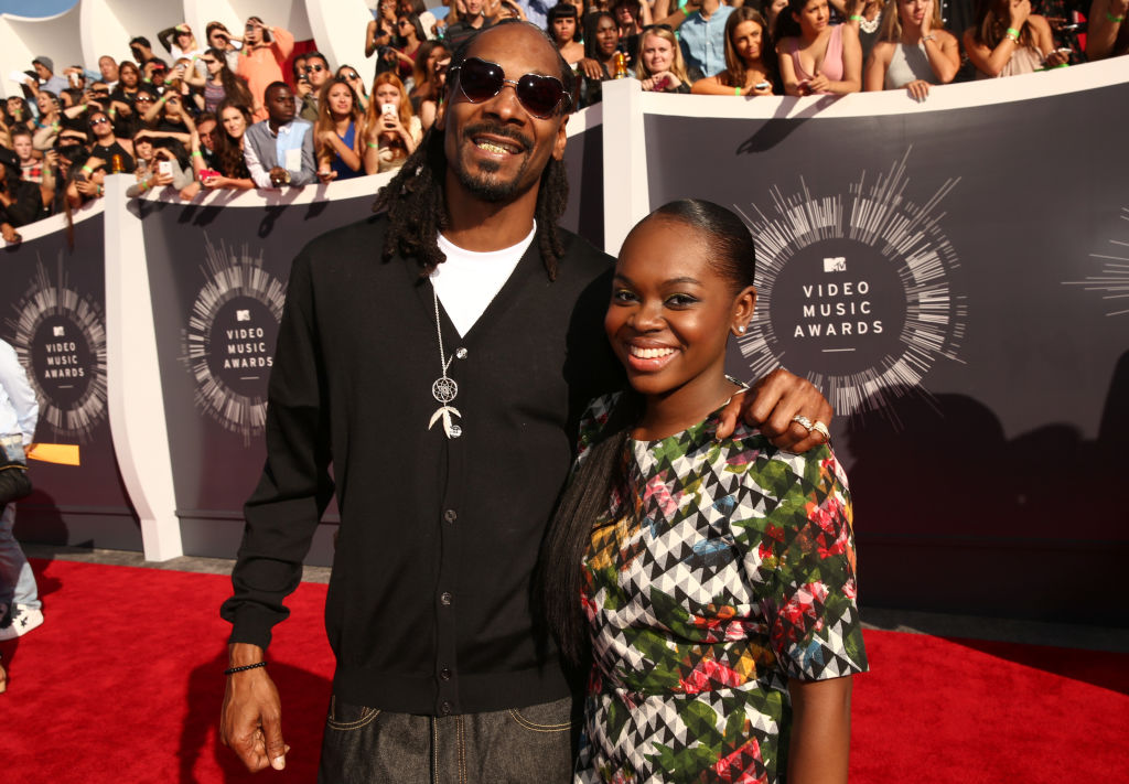 INGLEWOOD, CA - AUGUST 24: Recording artist Snoop Dogg (L) and Cori Broadus attend the 2014 MTV Video Music Awards at The Forum on August 24, 2014 in Inglewood, California. (Photo by Christopher Polk/Getty Images for MTV)
