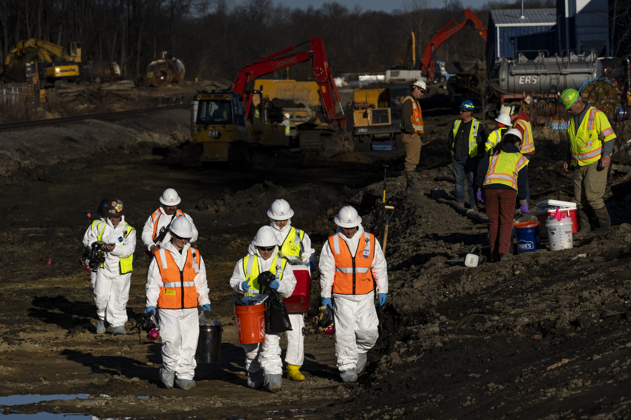 Ohio EPA and EPA contractors collect soil and air samples from the derailment site on March 9, 2023 in East Palestine, Ohio. Cleanup efforts continue after a Norfolk Southern train carrying toxic chemicals derailed causing an environmental disaster. Thousands of residents were ordered to evacuate after the area was placed under a state of emergency and temporary evacuation orders. (Photo by Michael Swensen/Getty Images)