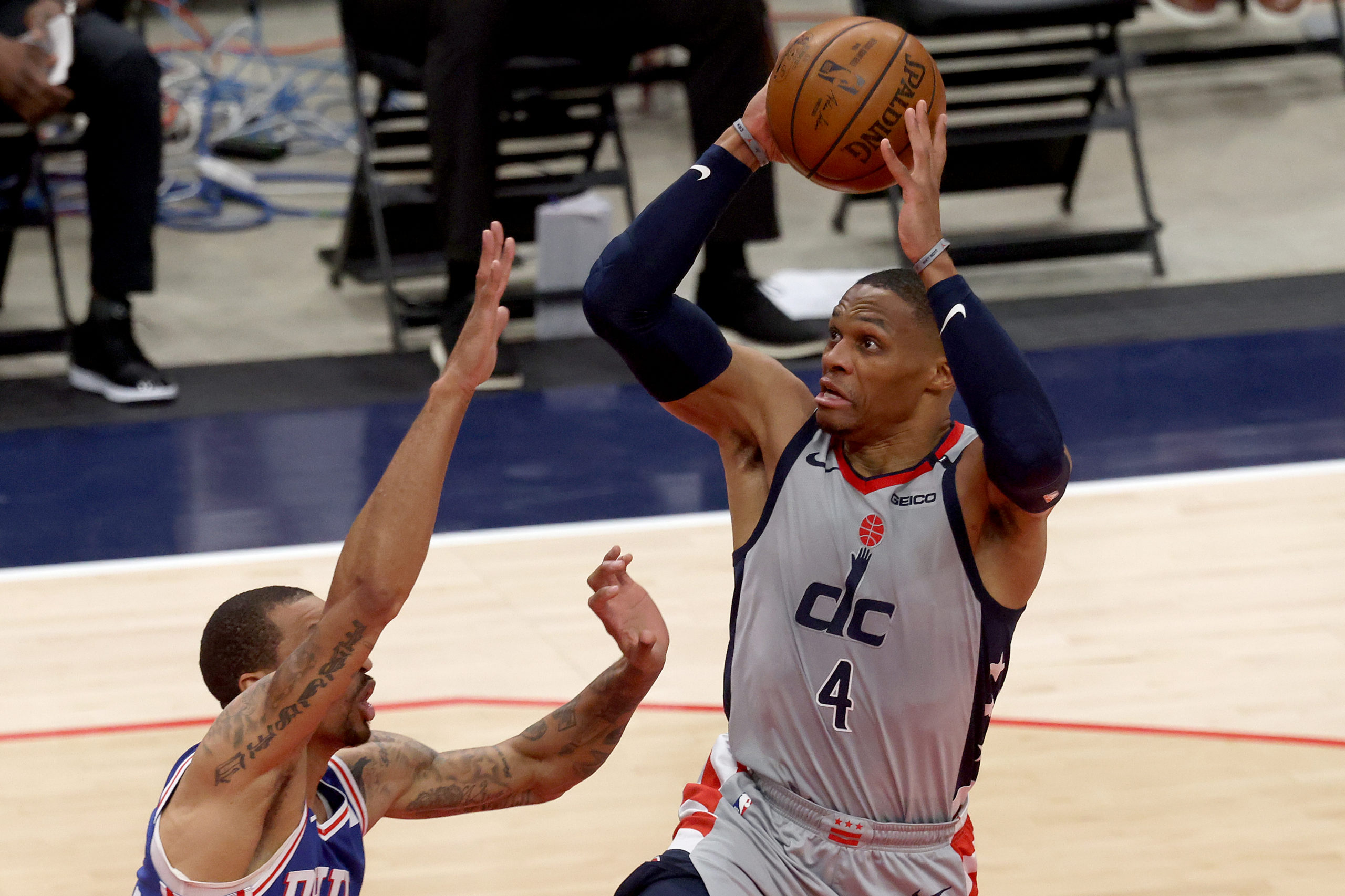 WASHINGTON, DC - MAY 29: Russell Westbrook #4 of the Washington Wizards puts up a shot against George Hill #33 of the Philadelphia 76ers in the first half during Game Three of the Eastern Conference first round series at Capital One Arena on May 29, 2021 in Washington, DC. Rob Carr/Getty Images