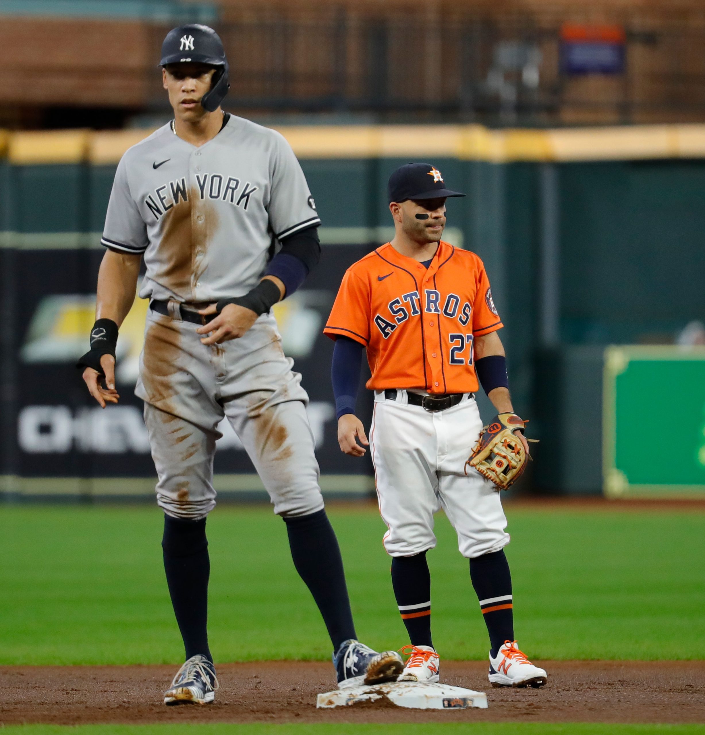 HOUSTON, TEXAS - JULY 09: Aaron Judge #99 of the New York Yankees stands on second base while Jose Altuve #27 of the Houston Astros looks on at Minute Maid Park on July 09, 2021 in Houston, Texas. Bob Levey/Getty Images