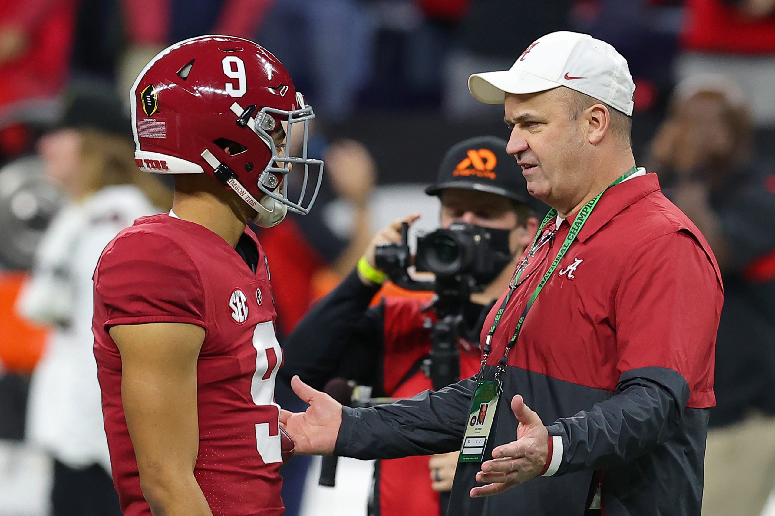 INDIANAPOLIS, INDIANA - JANUARY 10: Bryce Young #9 of the Alabama Crimson Tide, and Alabama Crimson Tide Offensive Coordinator Bill O'Brien talk prior to a game against the Georgia Bulldogs in the 2022 CFP National Championship Game at Lucas Oil Stadium on January 10, 2022 in Indianapolis, Indiana. Kevin C. Cox/Getty Images