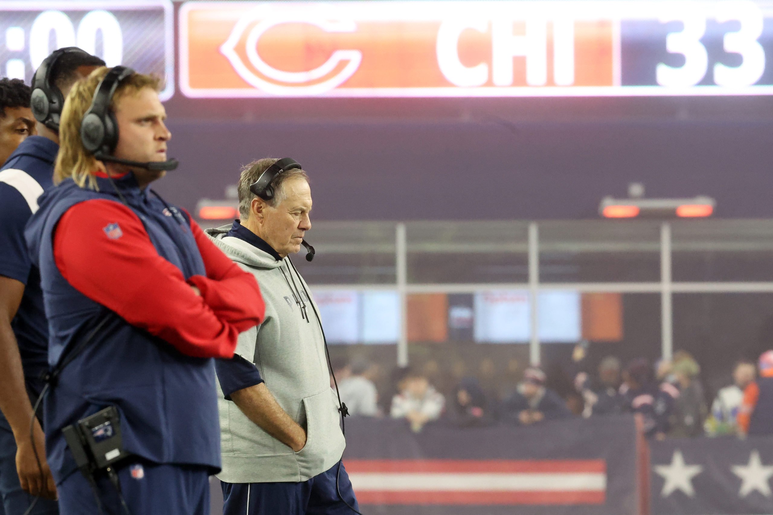 FOXBOROUGH, MASSACHUSETTS - OCTOBER 24: Outside linebackers coach Stephen Belichick and head coach Bill Belichick of the New England Patriots stand on the sideline during the fourth quarter against the Chicago Bears at Gillette Stadium on October 24, 2022 in Foxborough, Massachusetts. Maddie Meyer/Getty Images