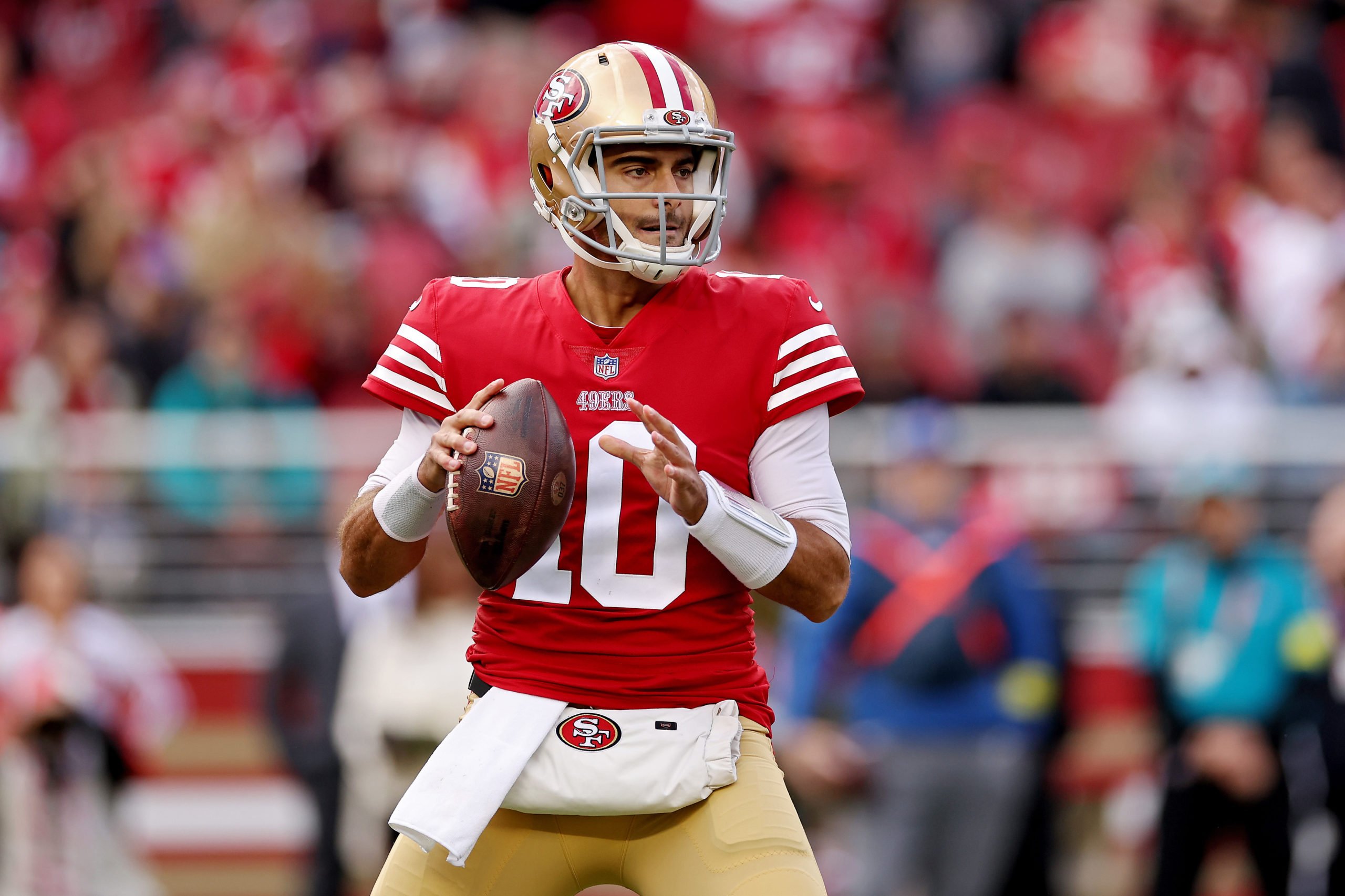 SANTA CLARA, CALIFORNIA - DECEMBER 04: Jimmy Garoppolo #10 of the San Francisco 49ers attempts a pass during the first quarter against the Miami Dolphins at Levi's Stadium on December 04, 2022 in Santa Clara, California. Ezra Shaw/Getty Images