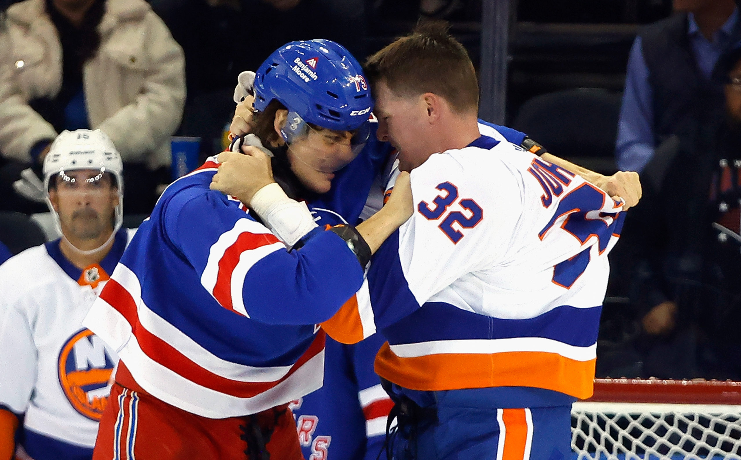 NEW YORK, NEW YORK - SEPTEMBER 26: Matt Rempe #73 of New York Rangers and Ross Johnston #32 of New York Islanders fight during the second period during a preseason game at Madison Square Garden on September 26, 2023 in New York City. Bruce Bennett/Getty Images