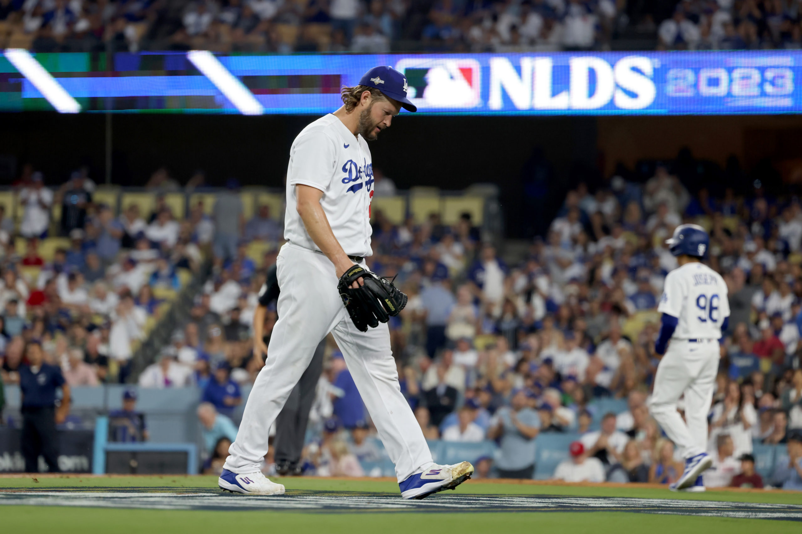 LOS ANGELES, CALIFORNIA - OCTOBER 07: Clayton Kershaw #22 of the Los Angeles Dodgers walks off the field after being relieved in the first inning against the Arizona Diamondbacks during Game One of the Division Series at Dodger Stadium on October 07, 2023 in Los Angeles, California. Harry How/Getty Images