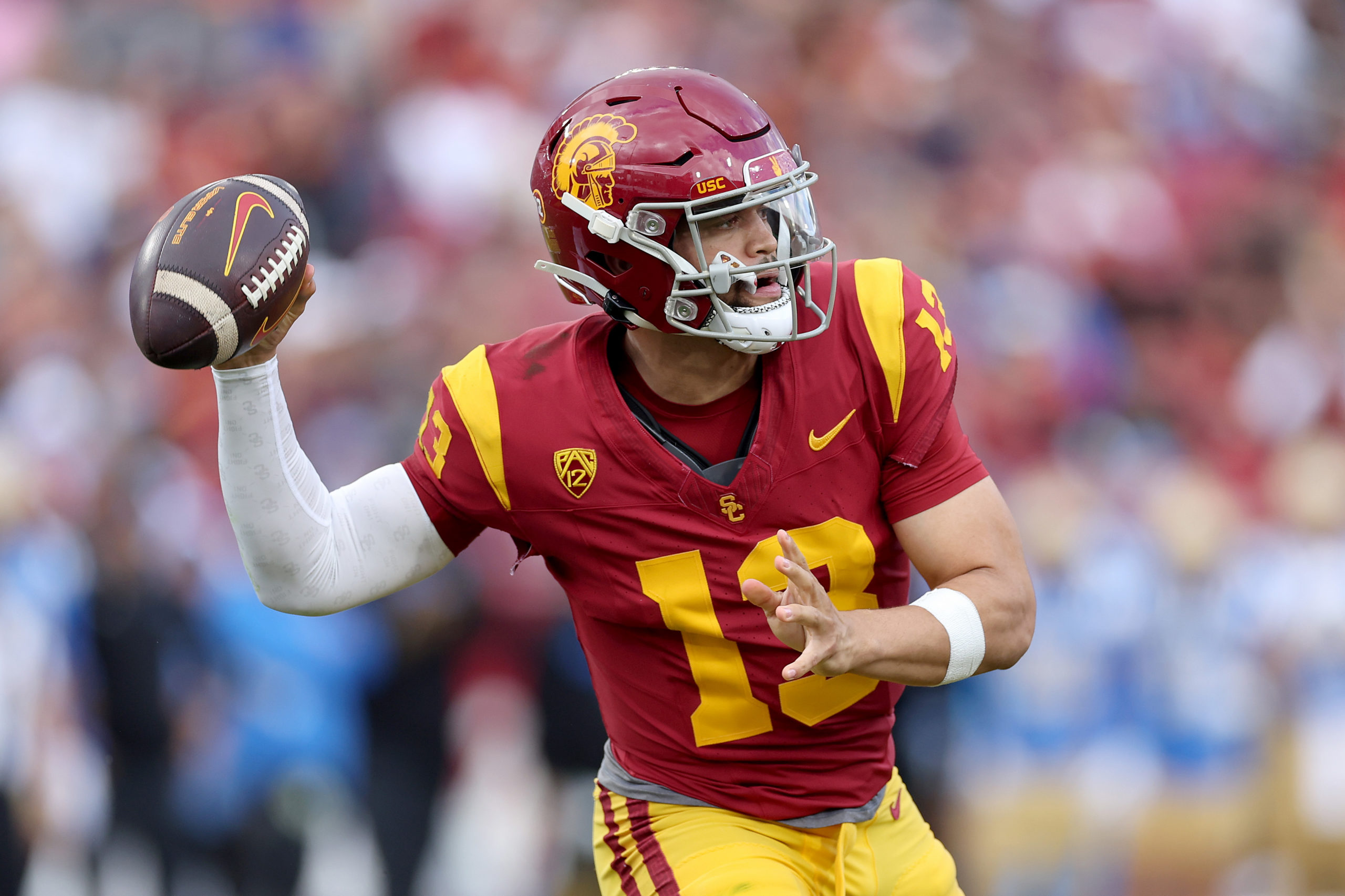 LOS ANGELES, CALIFORNIA - NOVEMBER 18: Caleb Williams #13 of the USC Trojans passes the ball during the first half of a game against the UCLA Bruins at United Airlines Field at the Los Angeles Memorial Coliseum on November 18, 2023 in Los Angeles, California. Sean M. Haffey/Getty Images
