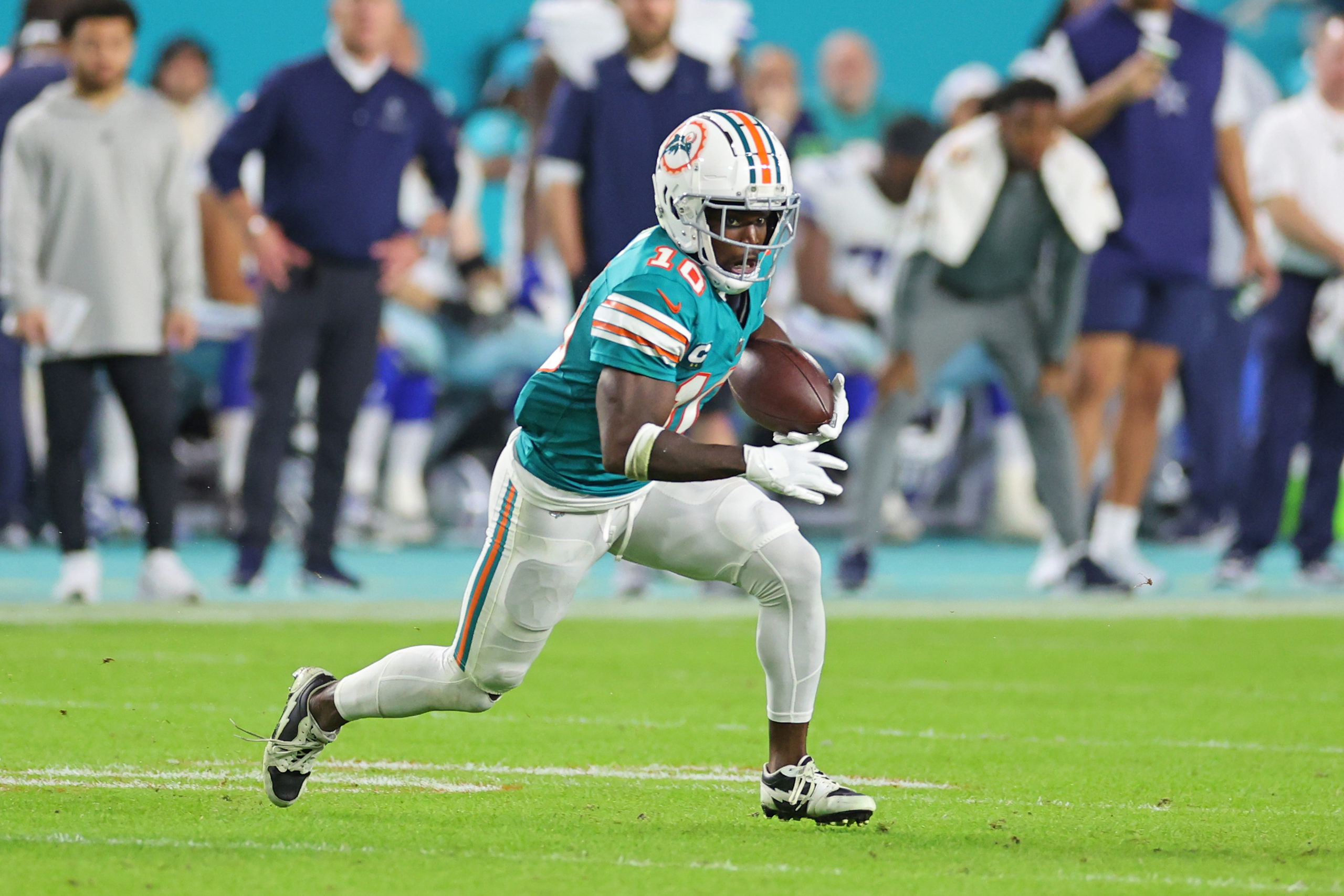 MIAMI GARDENS, FLORIDA - DECEMBER 24: Tyreek Hill #10 of the Miami Dolphins runs for yards during a game against the Dallas Cowboys at Hard Rock Stadium on December 24, 2023 in Miami Gardens, Florida. The Dolphins defeated the Cowboys 22-20. Stacy Revere/Getty Images
