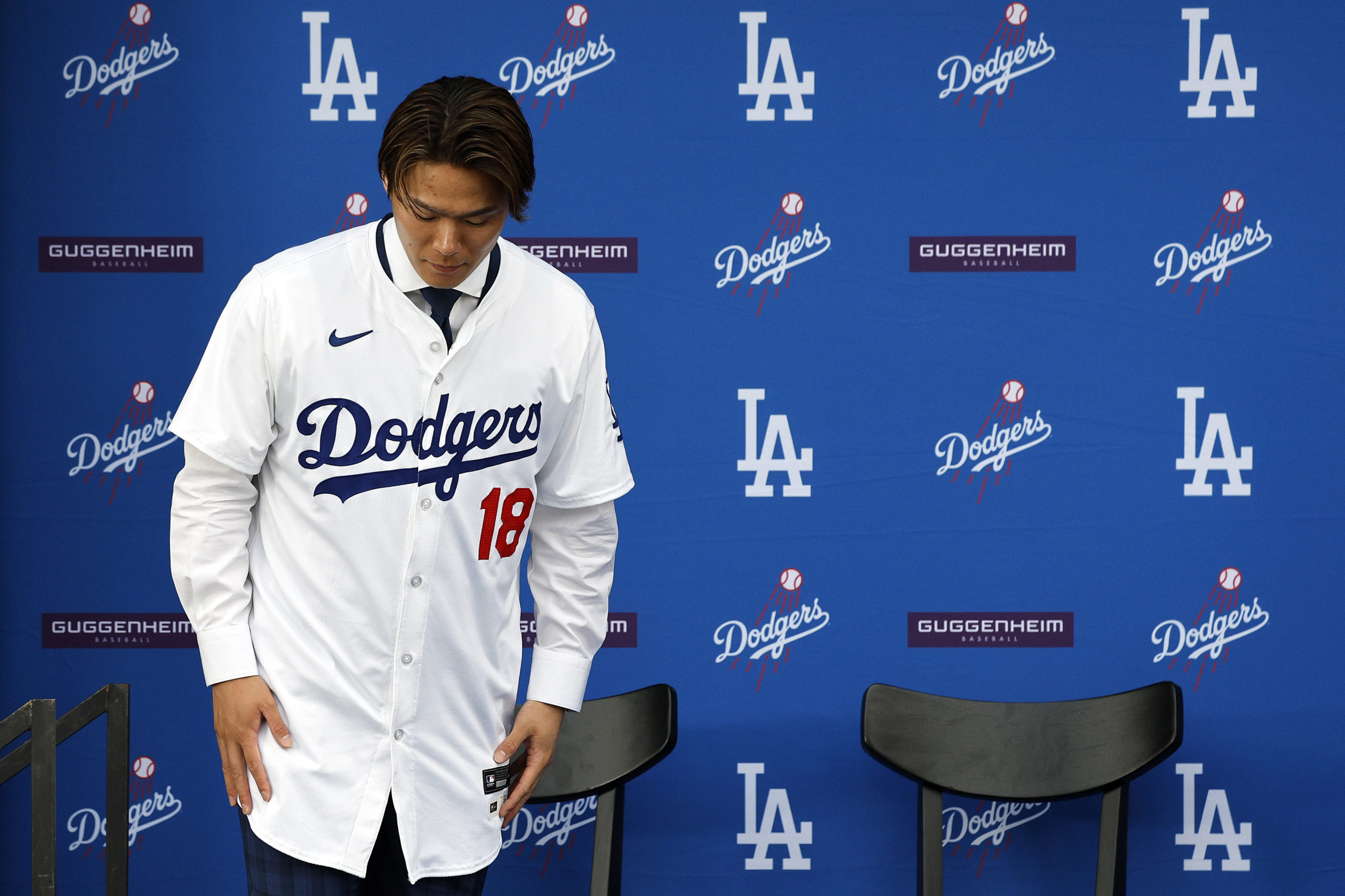 LOS ANGELES, CALIFORNIA - DECEMBER 27: Yoshinobu Yamamoto leaves the podium following an introductory press conference at Dodger Stadium on December 27, 2023 in Los Angeles, California. Kevork Djansezian/Getty Images