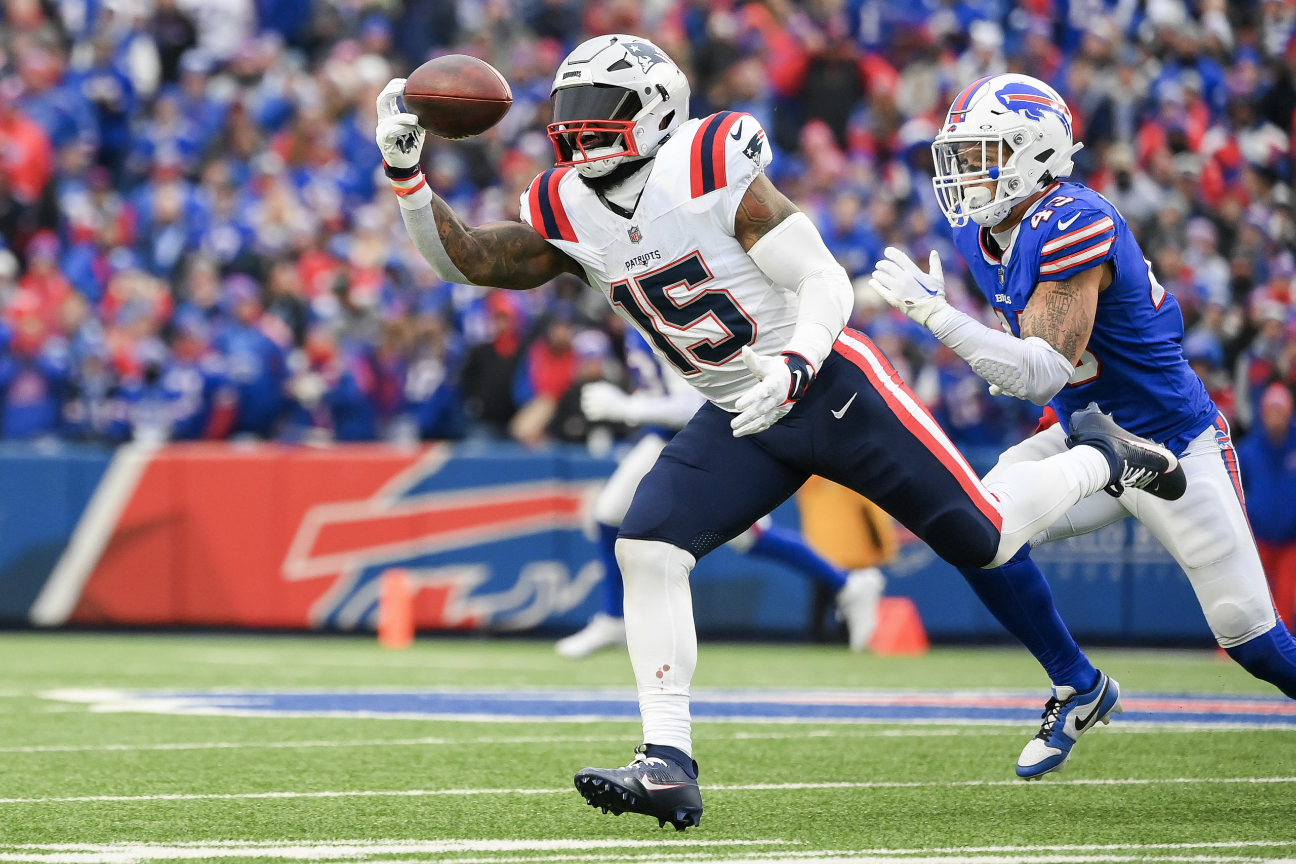 ORCHARD PARK, NEW YORK - DECEMBER 31: Ezekiel Elliott #15 of the New England Patriots catches a pass against the Buffalo Bills during the second half of the game at Highmark Stadium on December 31, 2023 in Orchard Park, New York. Rich Barnes/Getty Images