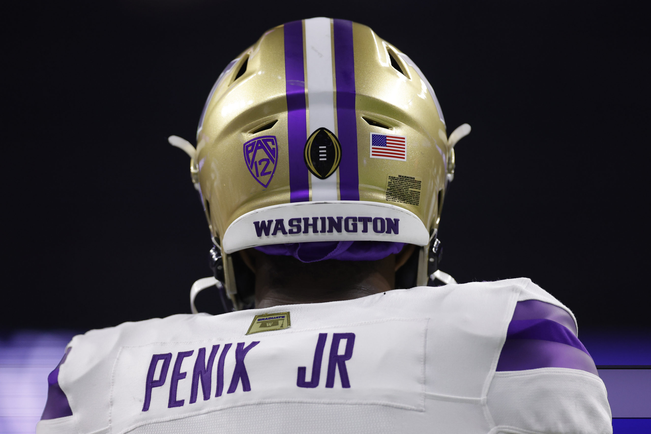 HOUSTON, TEXAS - JANUARY 08: A view of the back of Michael Penix Jr. #9 of the Washington Huskies in the third quarter against the Michigan Wolverines during the 2024 CFP National Championship game at NRG Stadium on January 08, 2024 in Houston, Texas. Carmen Mandato/Getty Images