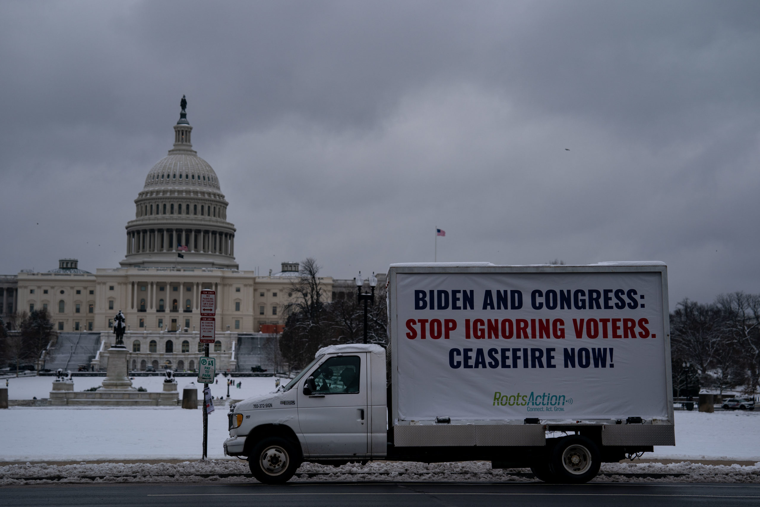  A truck parked third street sw displays a sign calling on President Biden and Congress for a ceasefire in view of the U.S. Capitol on January 16, 2024 in Washington, DC. The biggest snowfall in more than two years blanketed the Washington Metropolitan area shutting down schools and halting flights across the region. (Photo by Kent Nishimura/Getty Images)