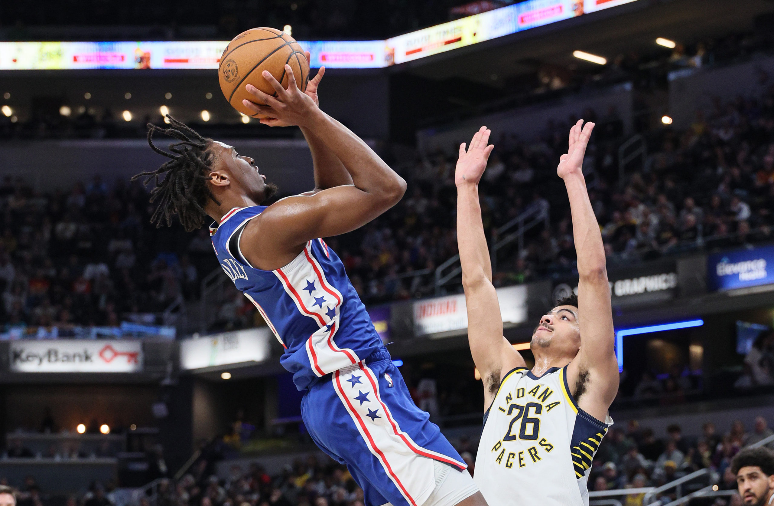INDIANAPOLIS, INDIANA - JANUARY 25: Tyrese Maxey #0 of the Philadelphia 76ers shoots the ball in the first half while defended by Ben Sheppard #26 of the Indiana Pacers at Gainbridge Fieldhouse on January 25, 2024 in Indianapolis, Indiana. Andy Lyons/Getty Images