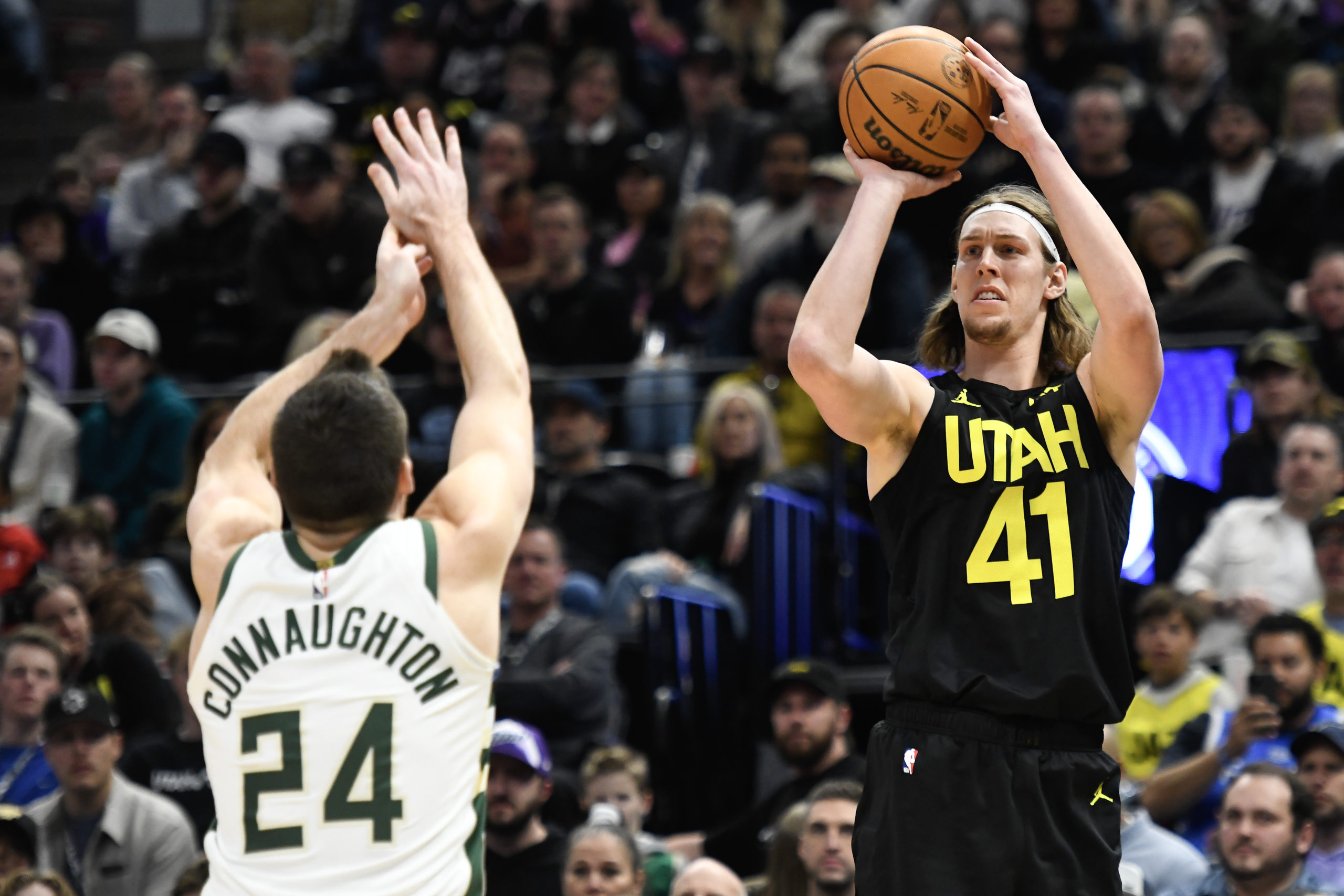 SALT LAKE CITY, UTAH - FEBRUARY 04: Kelly Olynyk #41 of the Utah Jazz shoots over Pat Connaughton #24 of the Milwaukee Bucks during the second half at Delta Center on February 04, 2024 in Salt Lake City, Utah. Alex Goodlett/Getty Images