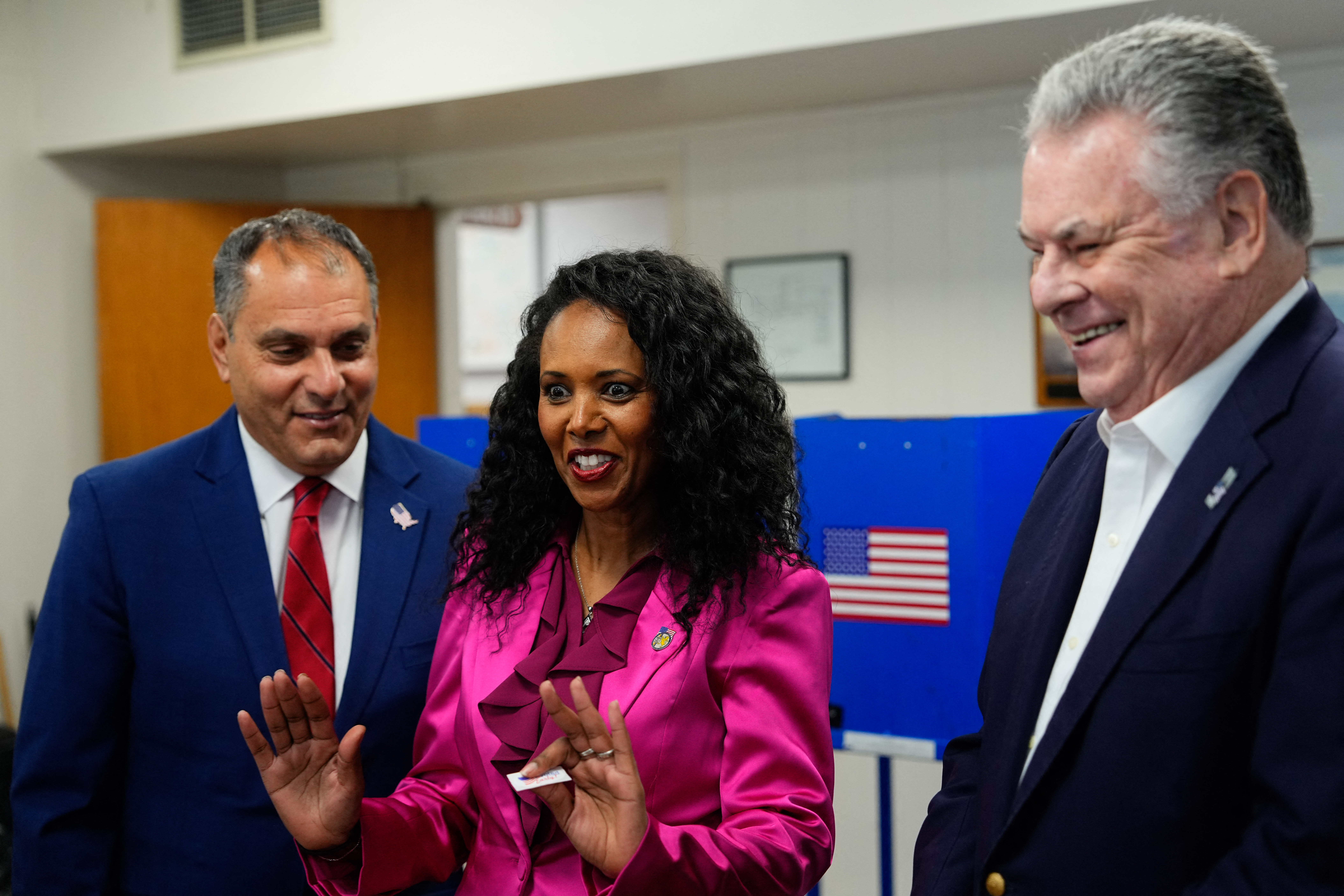 Mazi Melesa Pilip (C), US Republican Congressional candidate for New York's 3rd district, stands with (L-R) Town of Oyster Bay Supervisor Joseph Saladino and former US Representative Peter King, Republican from New York, after voting early at a polling station in Massapequa, New York, on February 9, 2024. Pilip is running against former US Representative Tom Suozzi, Democrat from New York, in a special election to replace expelled former US Representative George Santos. The special election will take place on February 13, 2024. (Photo by Adam Gray / POOL / AFP) (Photo by ADAM GRAY/POOL/AFP via Getty Images)