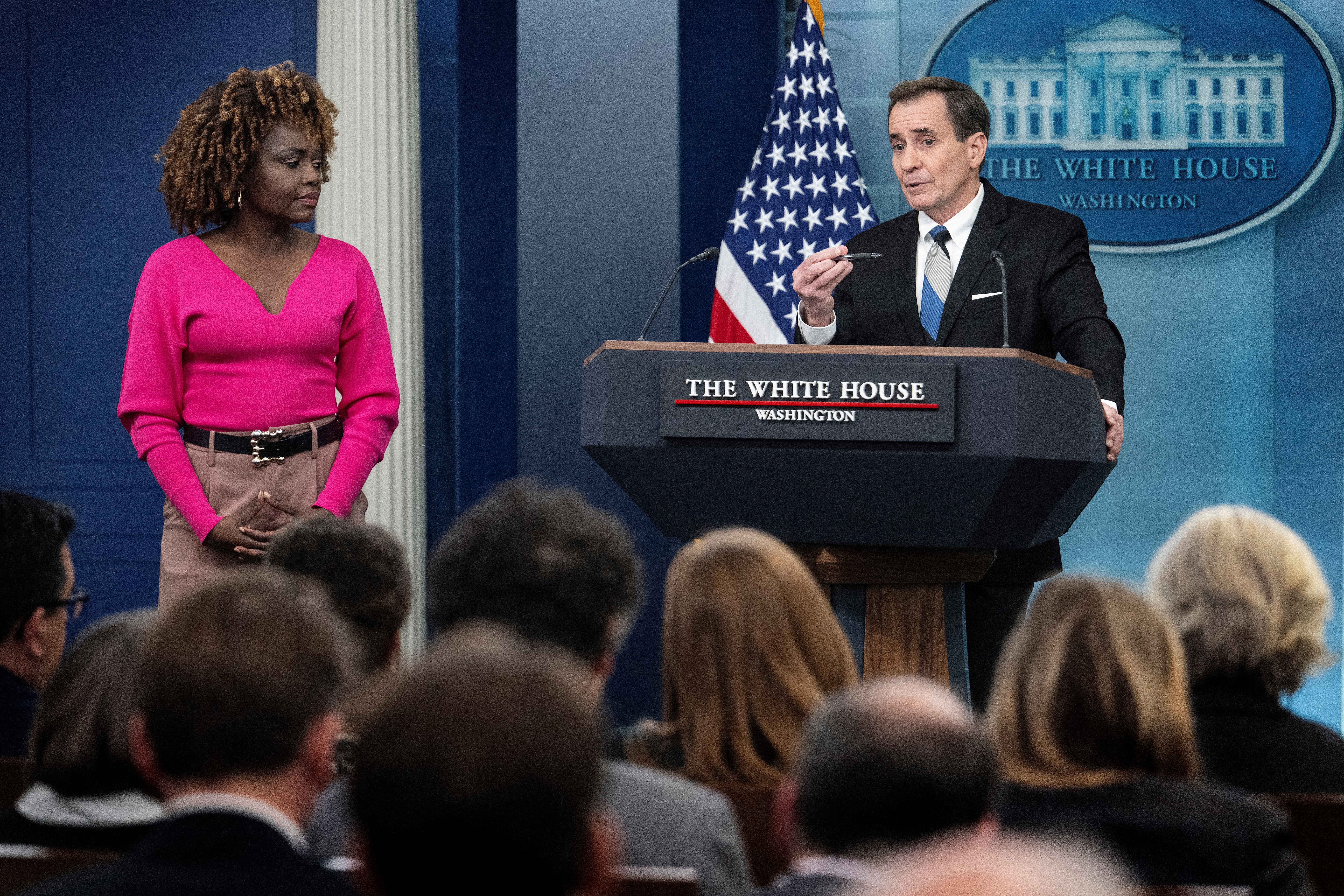 White House Press Secretary Karine Jean-Pierre (L) looks on as US National Security Council spokesman John Kirby speaks during the daily press briefing at the White House in Washington, DC, on February 15, 2024. (Photo by Jim WATSON / AFP) (Photo by JIM WATSON/AFP via Getty Images)